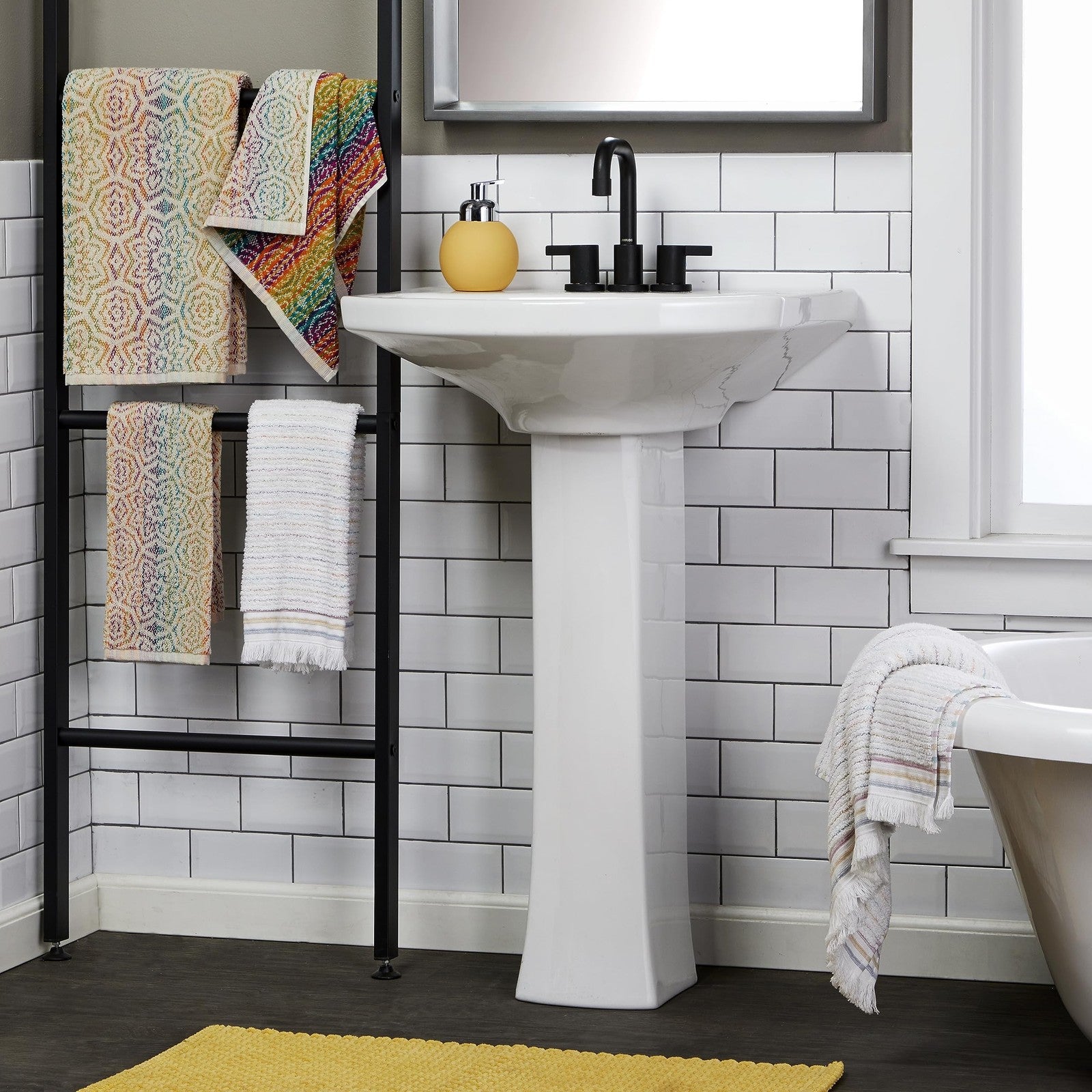 Set of two SKL Home Rhapsody bath and hand towels in multi-color, soft and plush fabric for bathroom use.