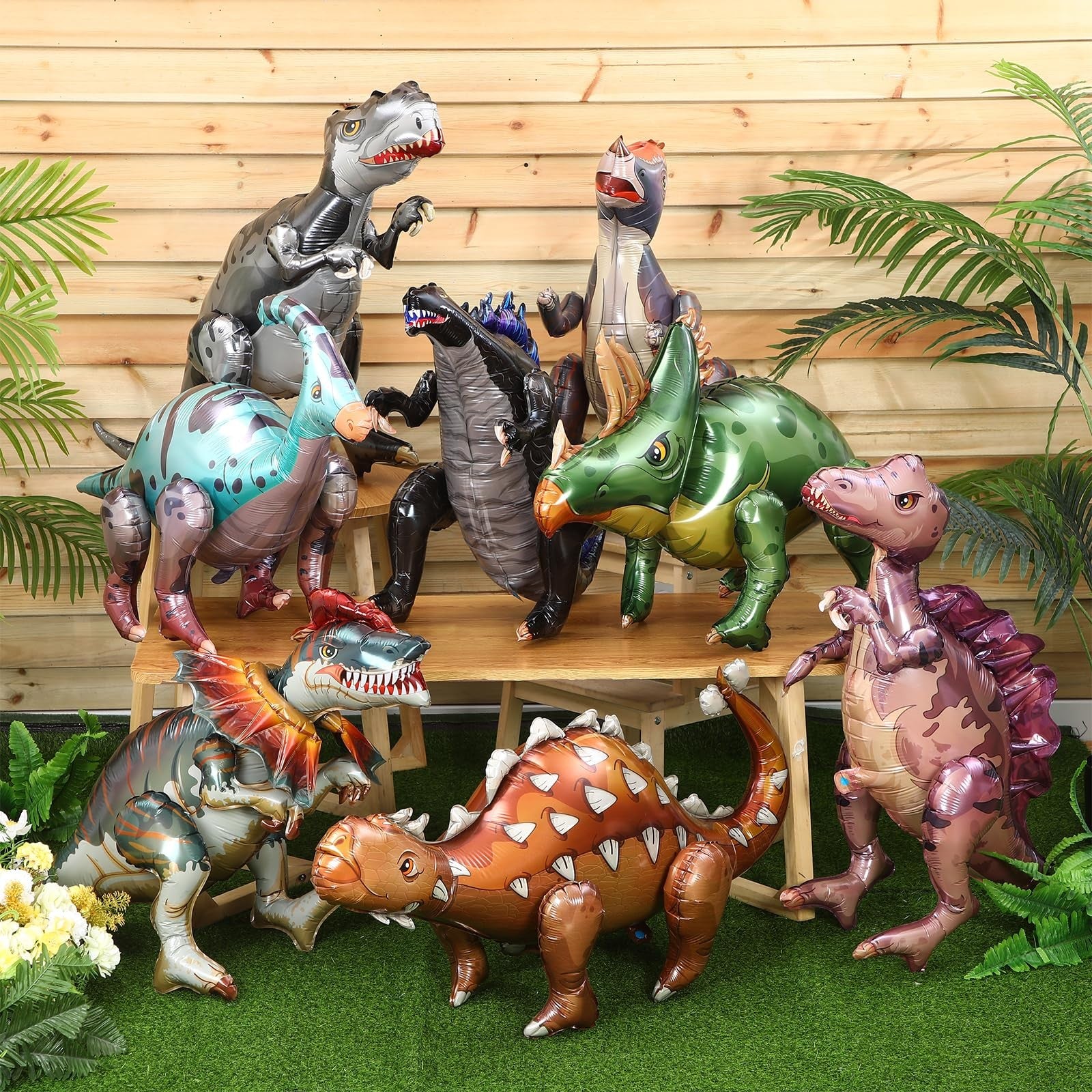 Vinsot 8-pack of giant inflatable dinosaur toys for birthday party decorations, featuring colorful 3D dinosaur figures.