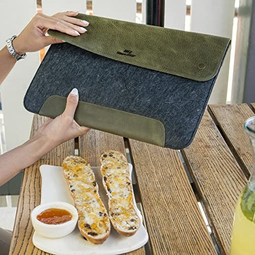 MegaGear genuine leather and fleece MacBook bag with padded sleeve for MacBook Pro, featuring a sleek, protective design.
