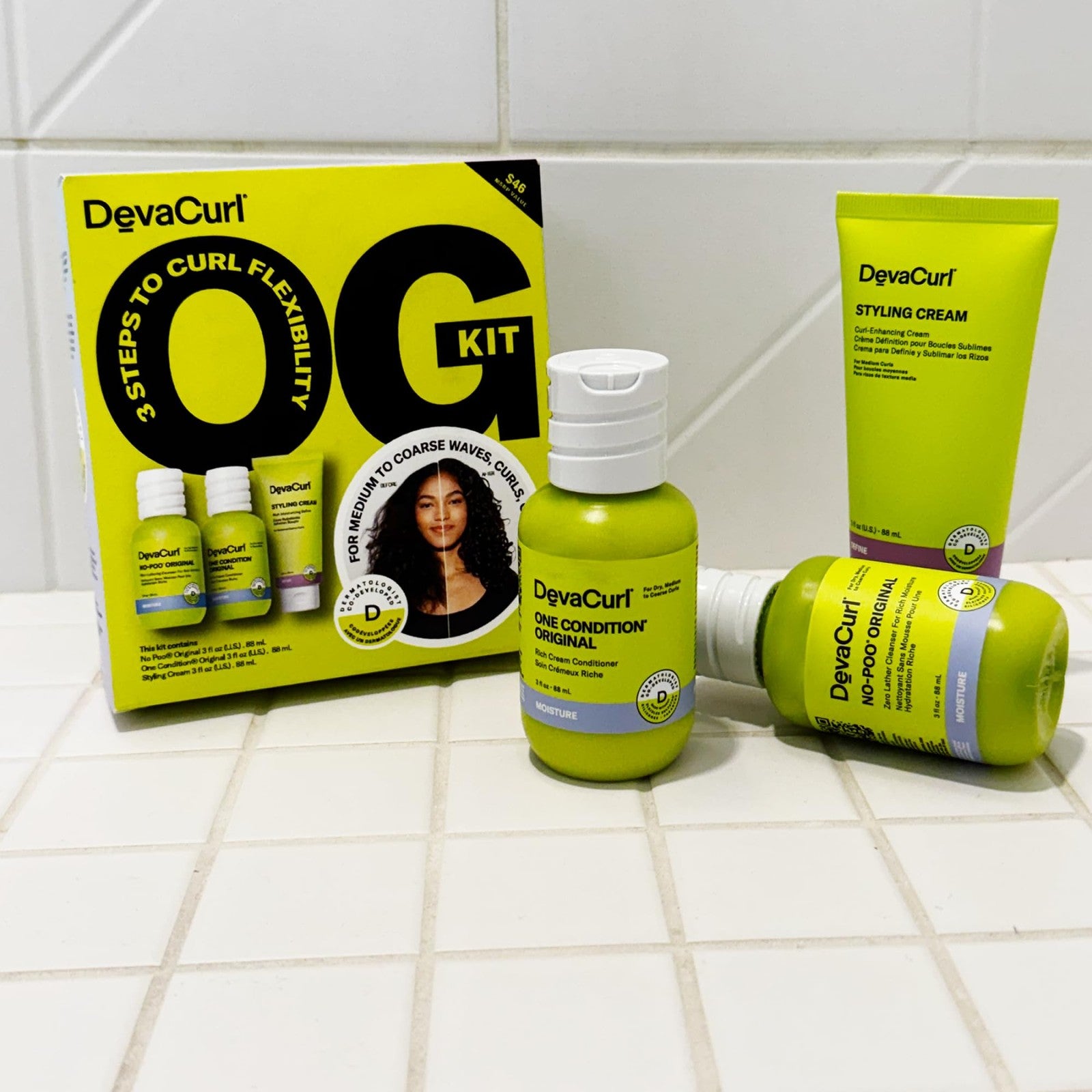 DevaCurl OG Kit with No-Poo, One Condition, and Styling Cream for curly hair care, displayed in a set on a white background.