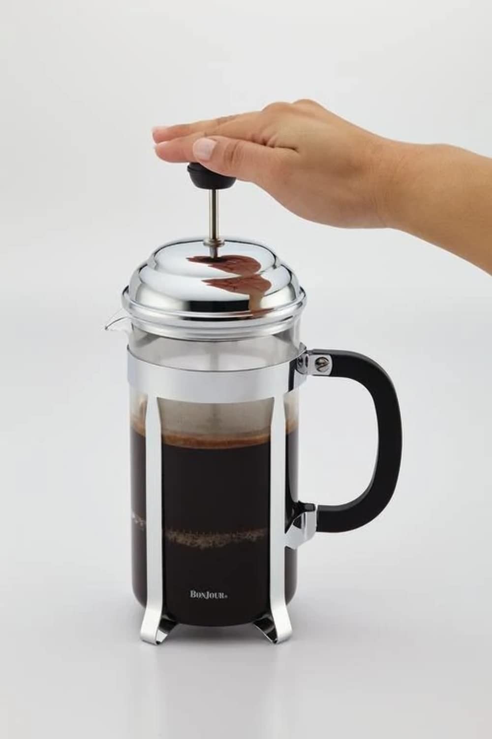 BonJour stainless steel French press with glass carafe, 33.8-ounce capacity, for brewing fresh coffee.