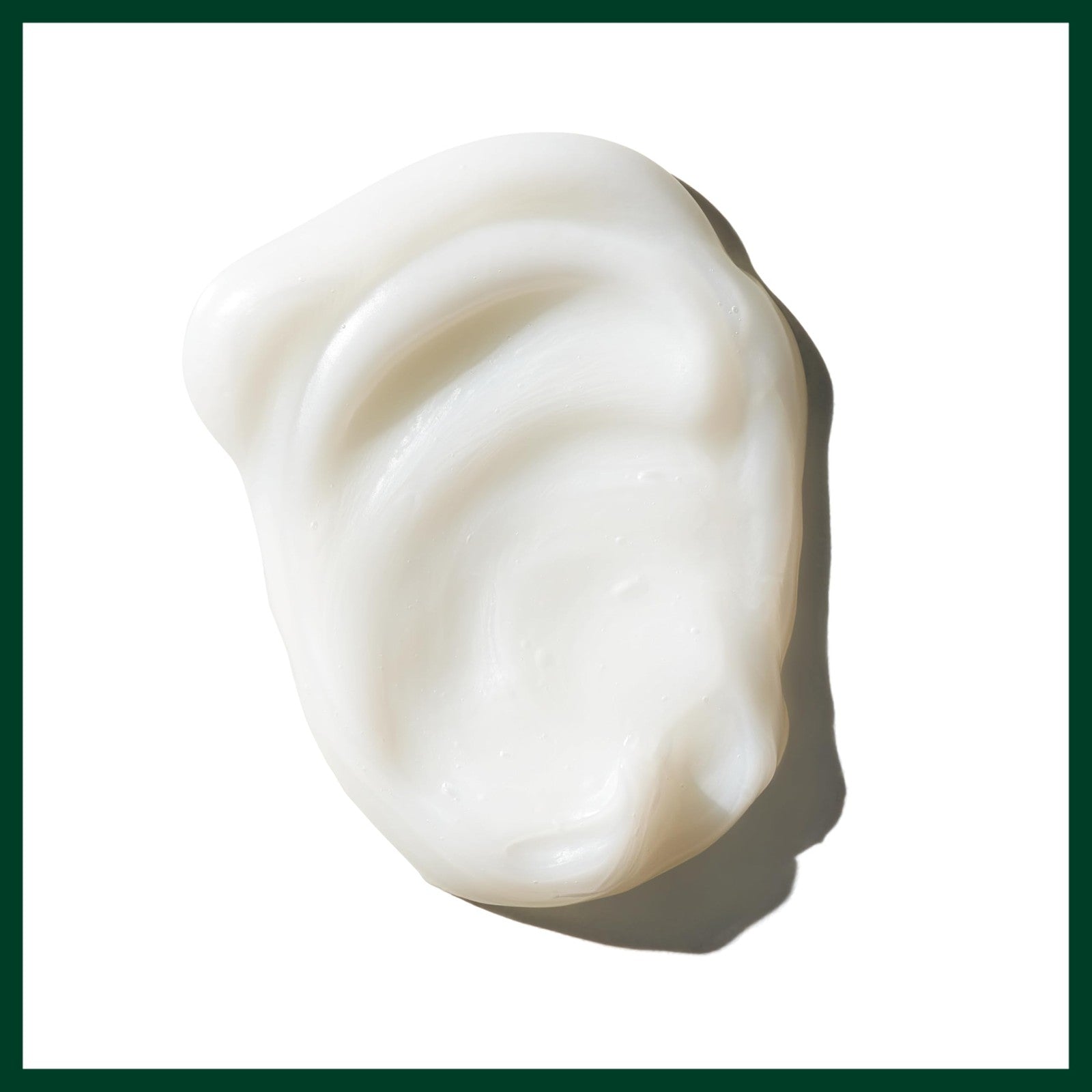 Aveda Damage Remedy Restructuring Conditioner for damaged hair, showing the conditioner bottle with a sleek green design.