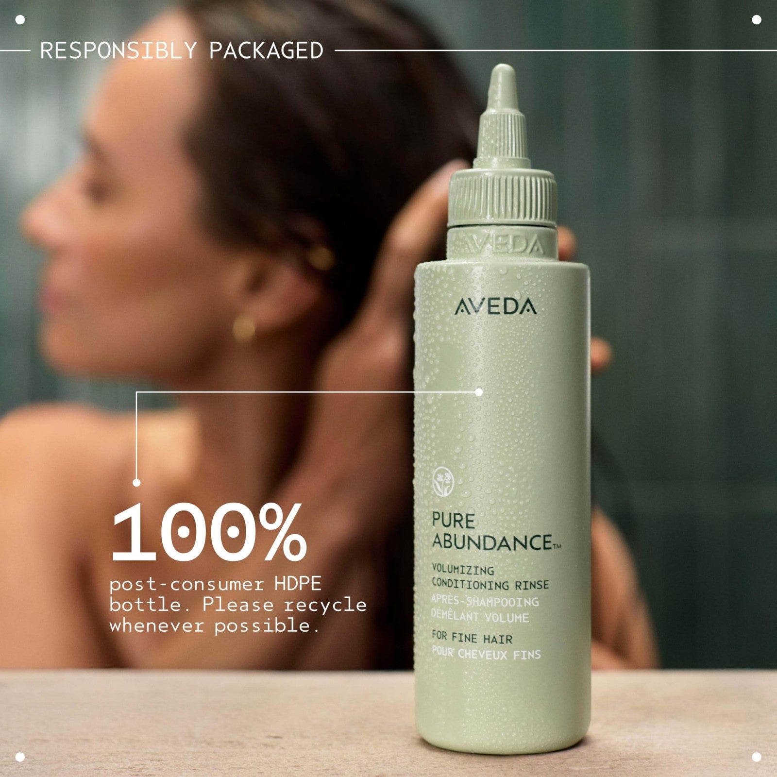 Aveda Pure Abundance Volumizing Conditioning Rinse in a clear bottle with a white cap, designed for lightweight hair volume.
