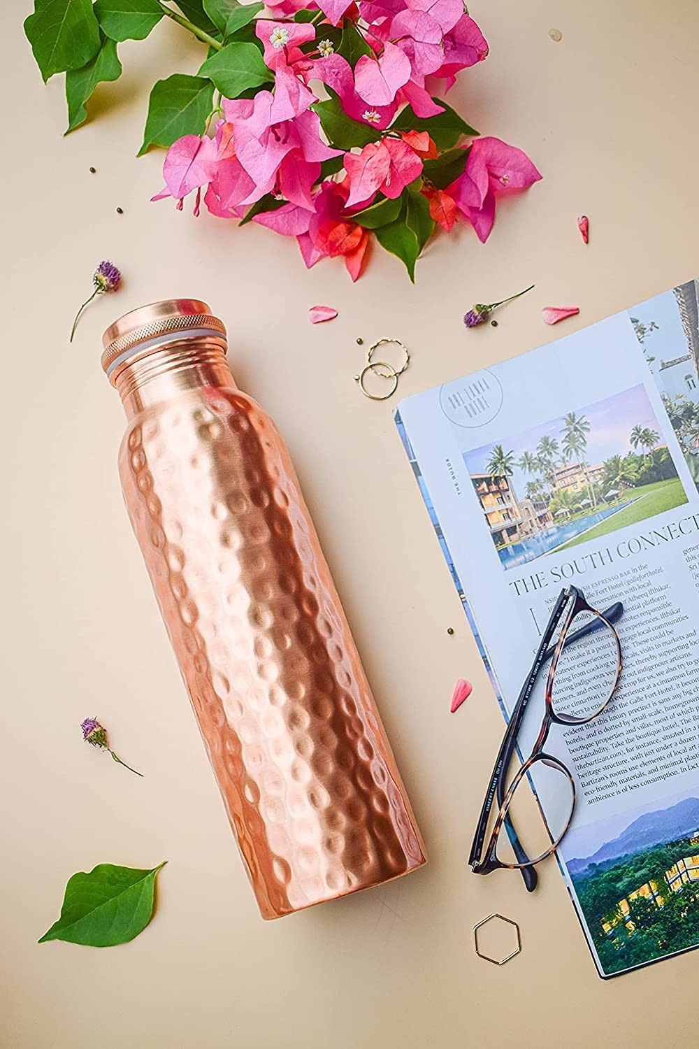 Hammered copper water bottle by Unbranded, traditional Ayurvedic pure copper vessel for storing drinking water.