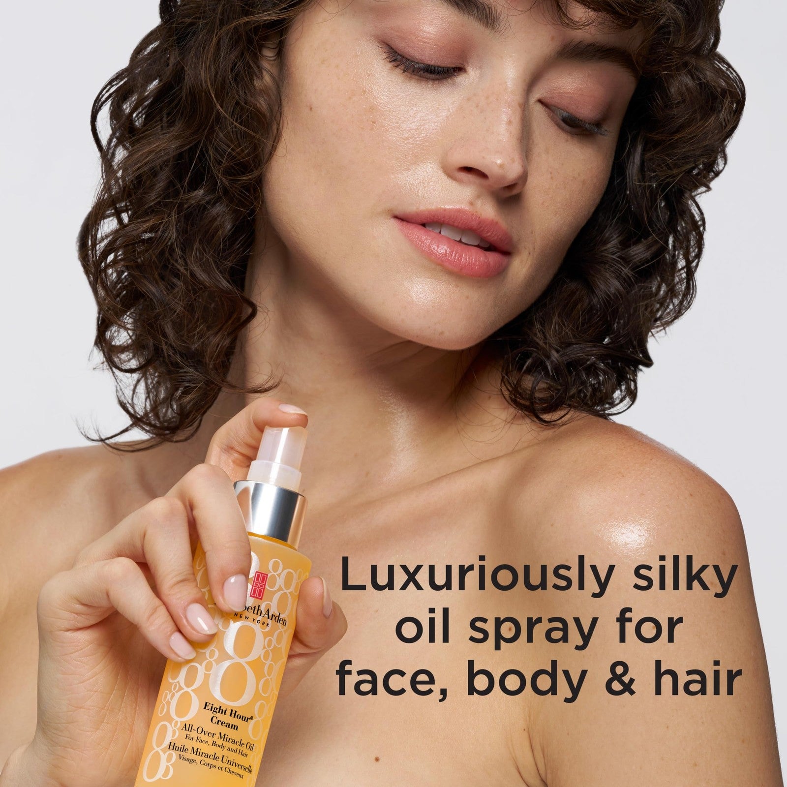 Elizabeth Arden Eight Hour Miracle Oil bottle with pump, showcasing the all-over face, body, and hair hydrator in a sleek container.