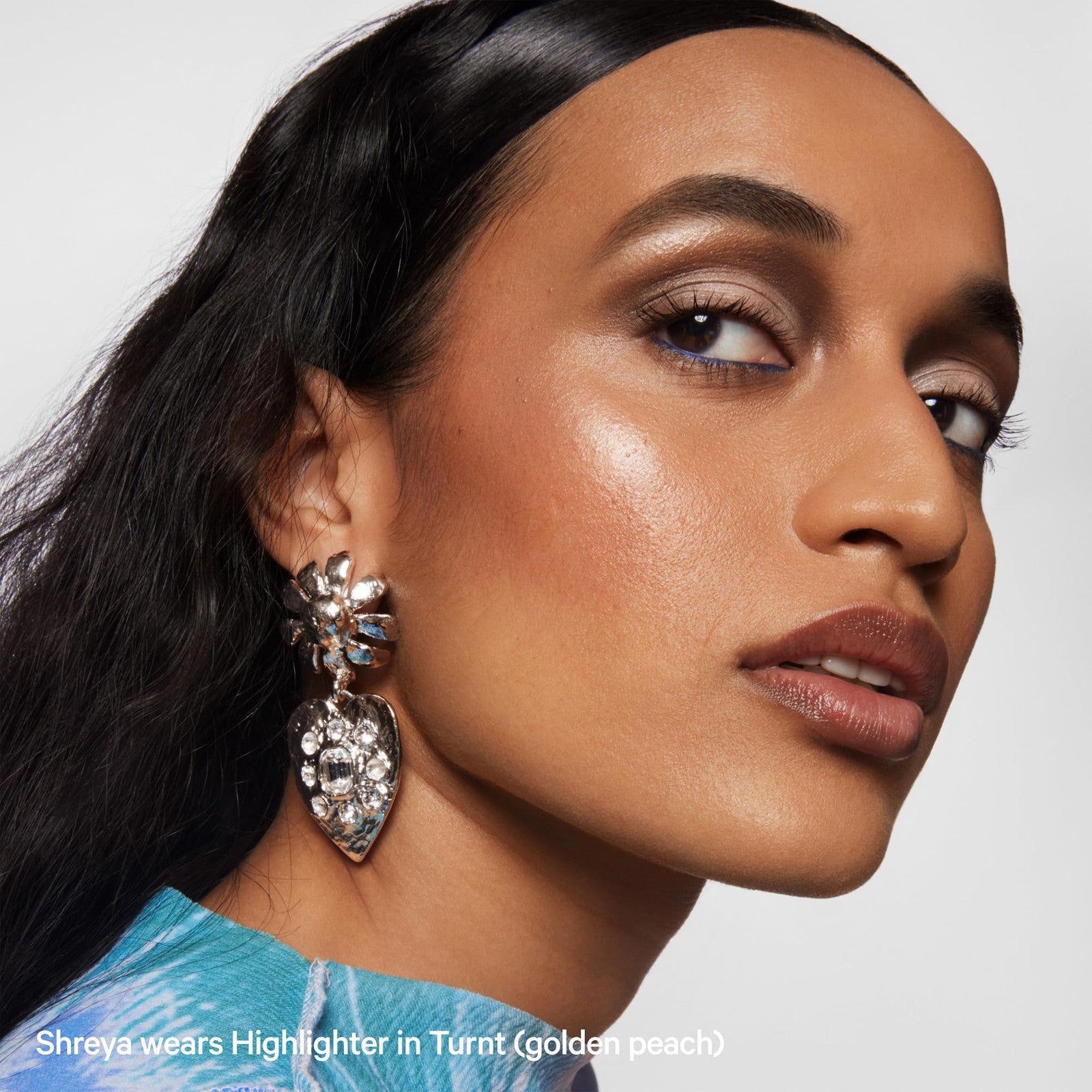 Milk Makeup highlighter stick for face and body, shimmery and radiant cream highlighter with a smooth, luminous finish.