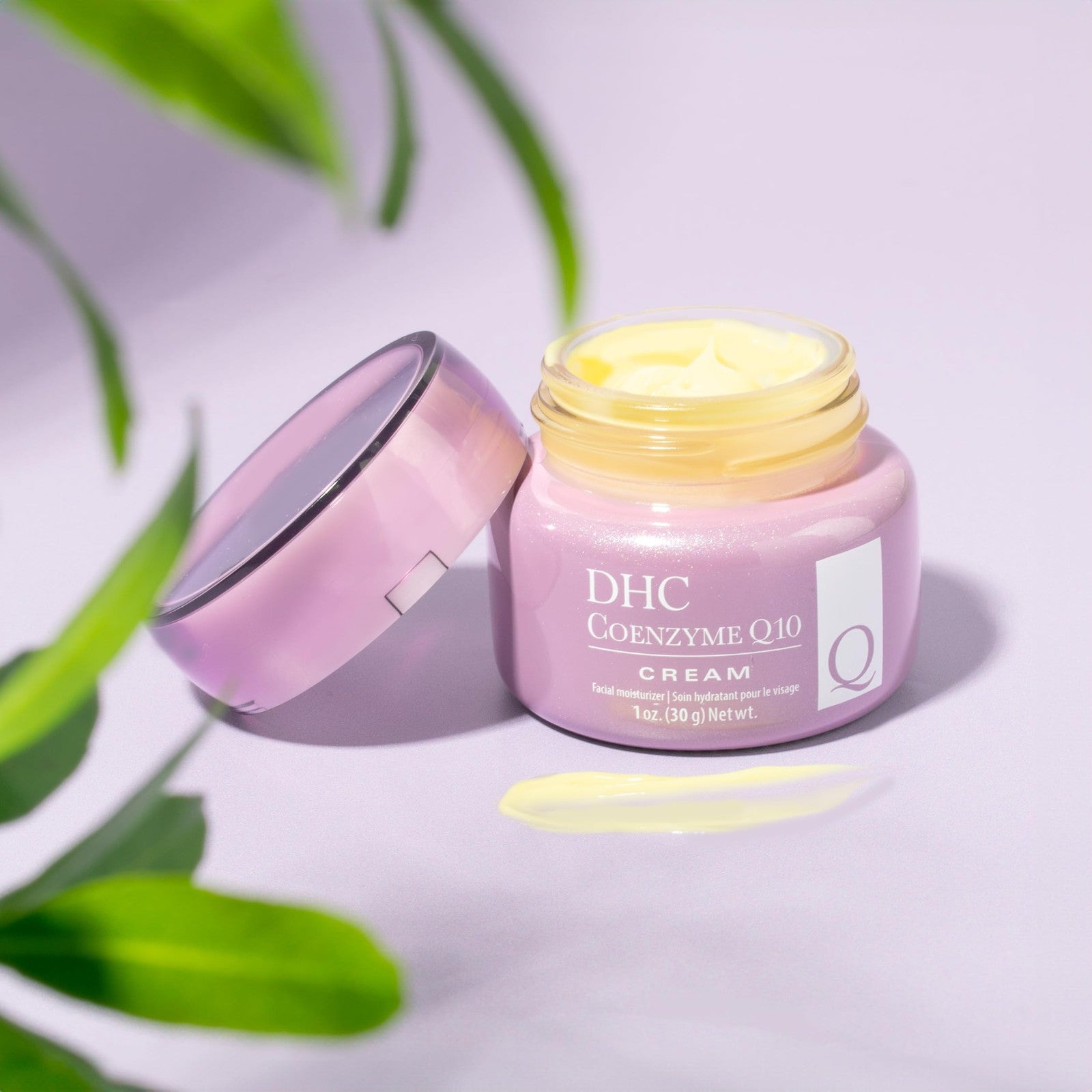 DHC Q10 Cream age-defying moisturizer for dry skin in a 1.7 oz jar with a white lid and creamy texture