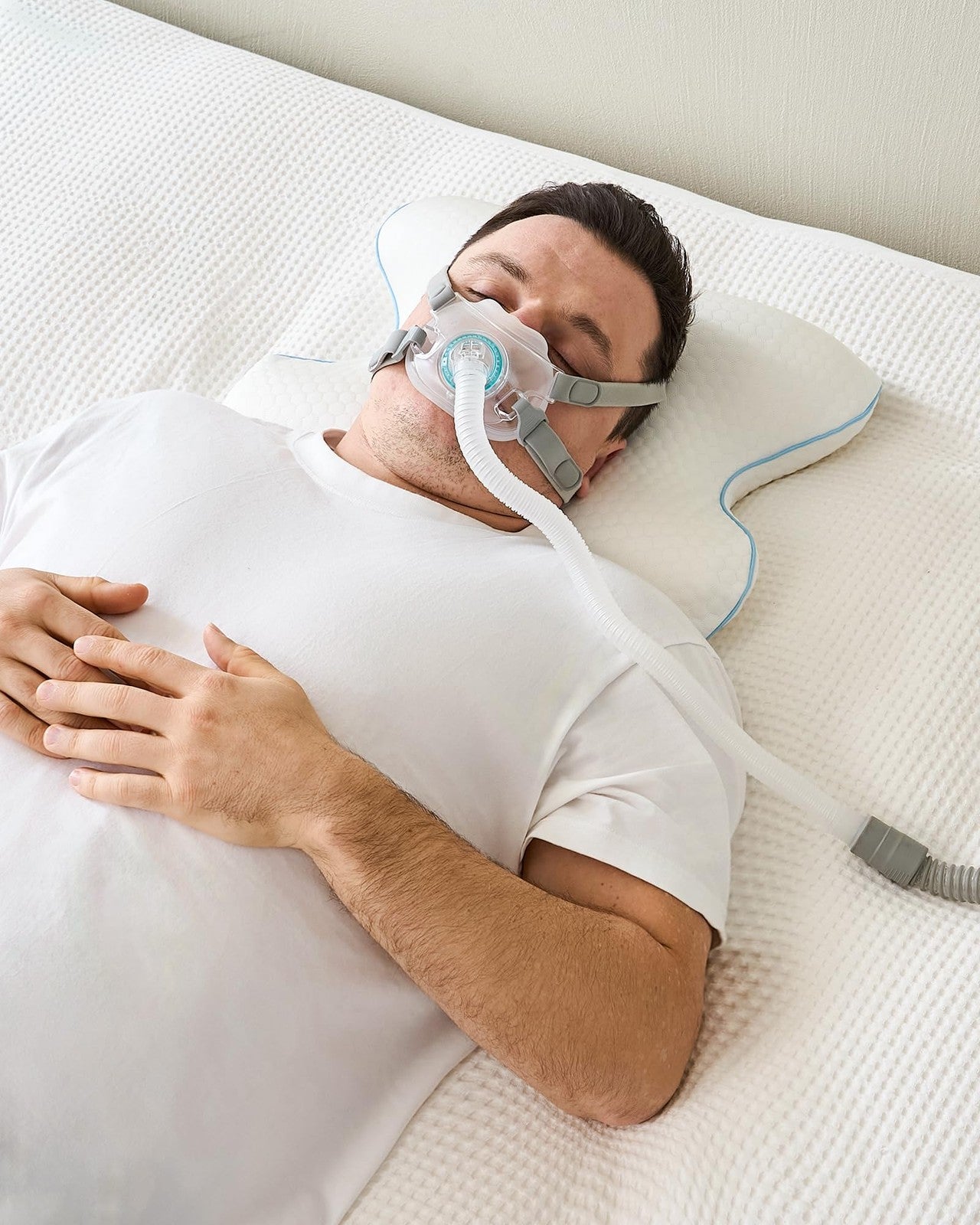 Unbranded Joynox CPAP bed pillow with cervical support, designed for side and back sleepers, shown in a plush, contoured shape.