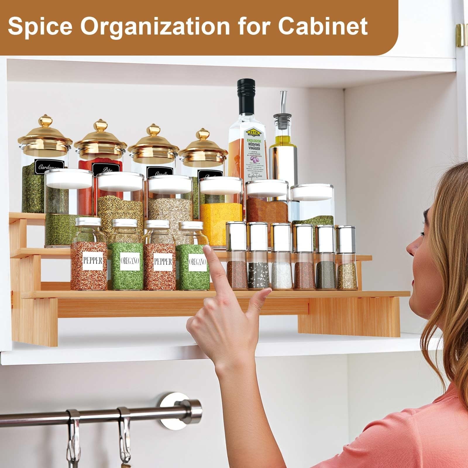 JinDoWin 3-tier spice rack organizer for cabinet, showing stacked spice jars neatly arranged on a kitchen shelf.