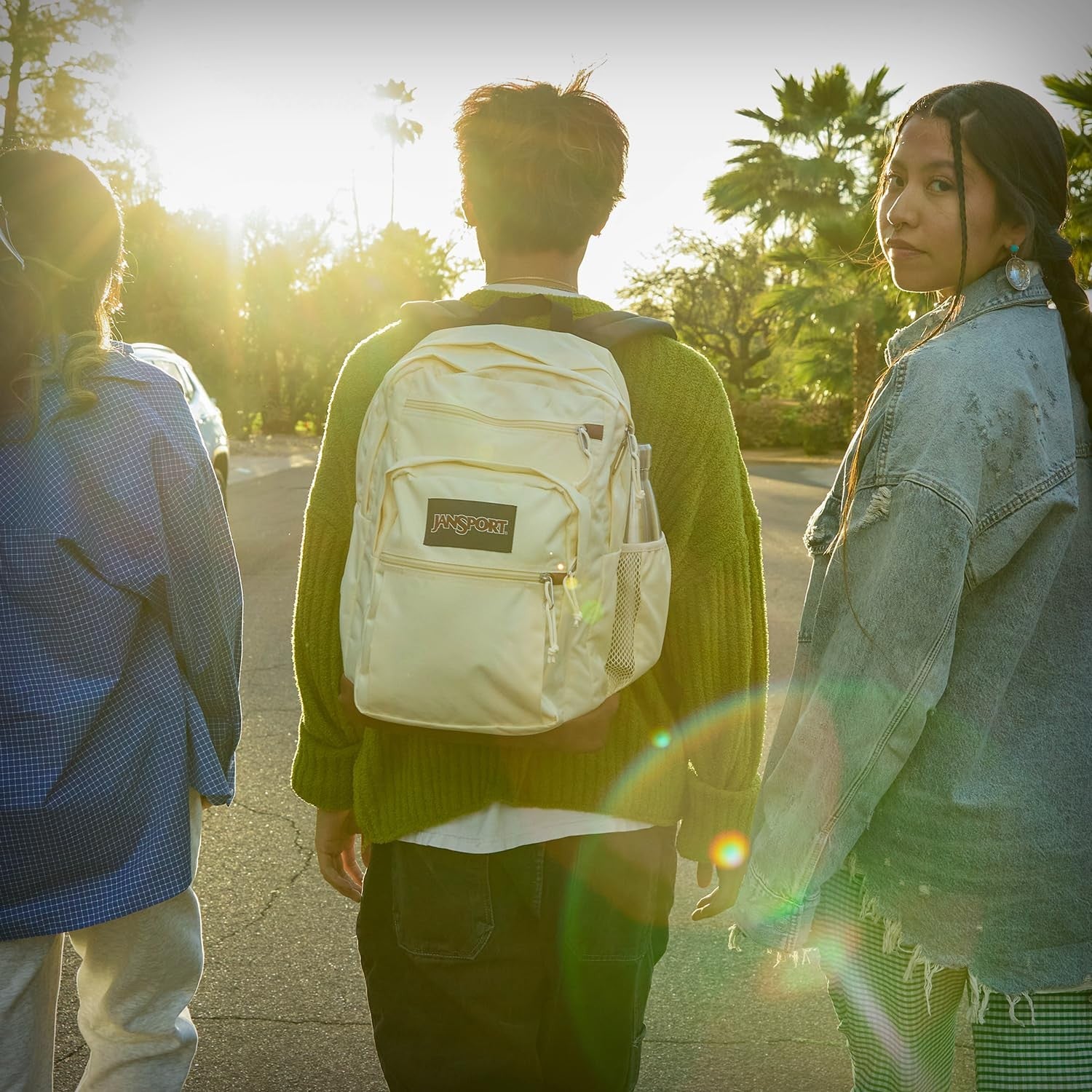 JanSport Cool backpack with large laptop sleeve, dual compartments, and rucksack design, ideal for carrying computers and essentials.