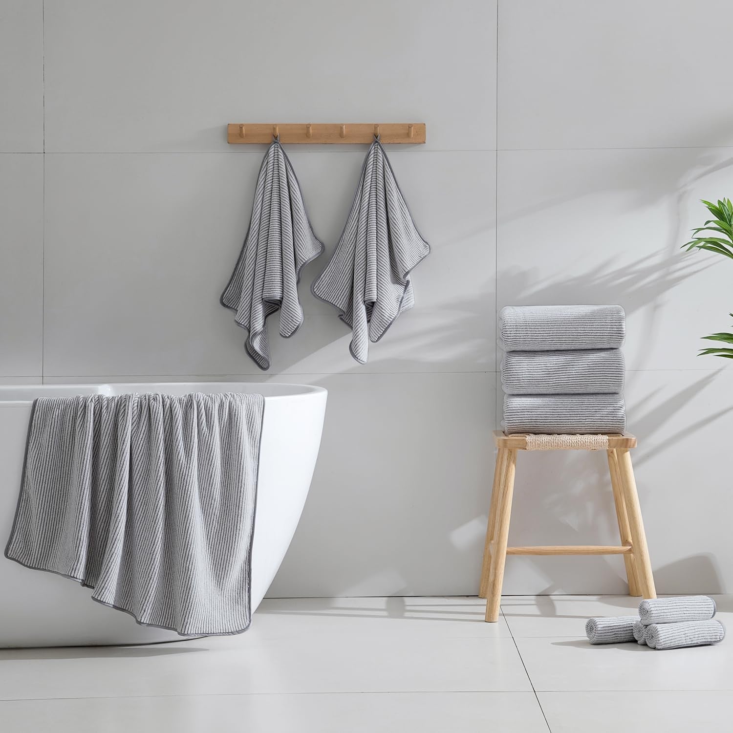 Jessy Home 4-piece oversized bath towel set with soft, fluffy, and extra-large 35x70-inch towels displayed stacked and folded.