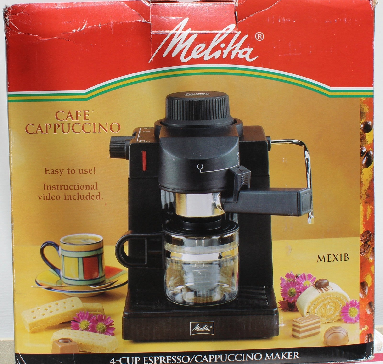 Melitta MEX1B espresso cappuccino machine with stainless steel finish and compact design, featuring a steam wand and control panel.