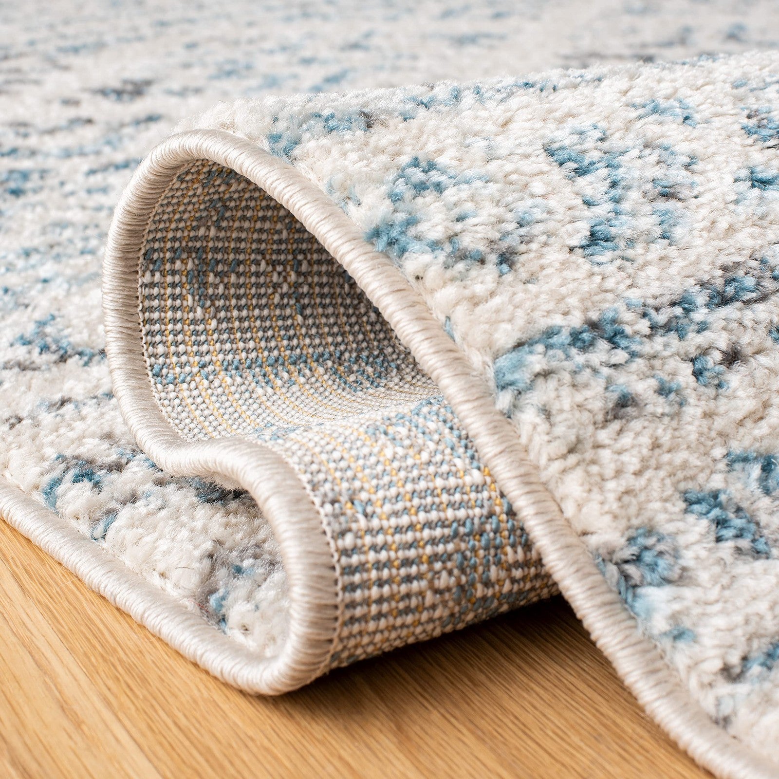 Safavieh Tulum Collection 6x9 ivory and turquoise Moroccan boho tribal area rug with tribal patterns and tribal motifs.