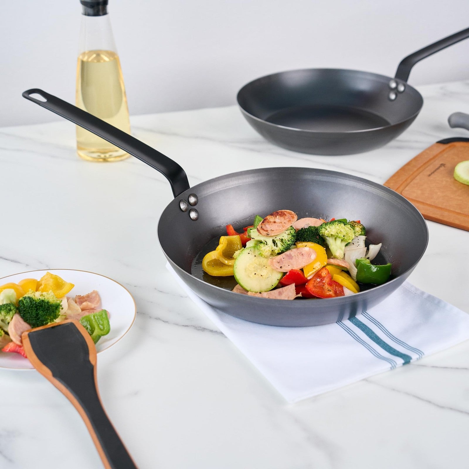 Restaurantware Met Lux 12-inch lightweight fry pan with triple-rive induction-ready design, suitable for versatile cooking.