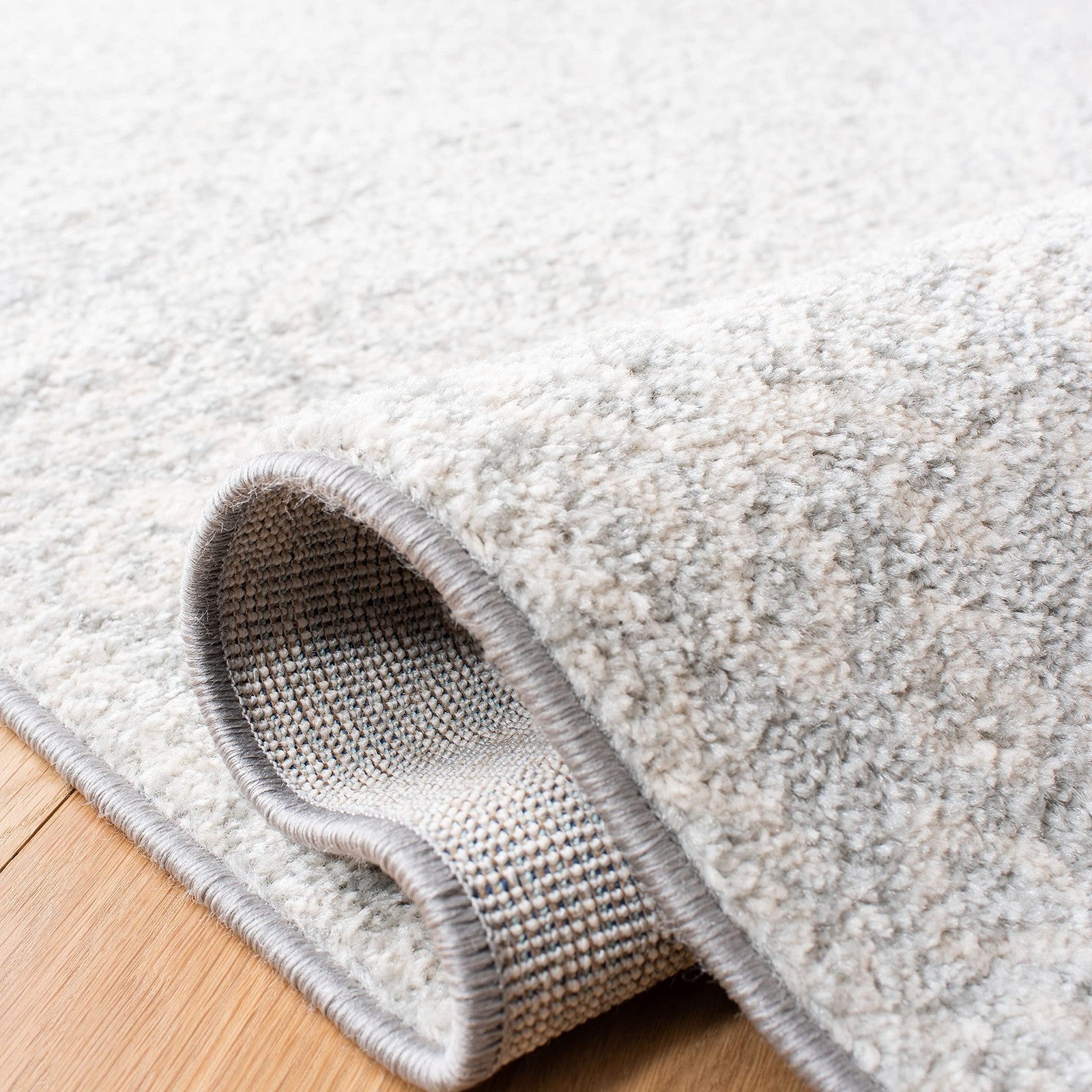 Light grey and ivory Safavieh Tulum Collection runner rug with Moroccan boho design, measuring 2 x 9 feet, showcasing intricate patterns.