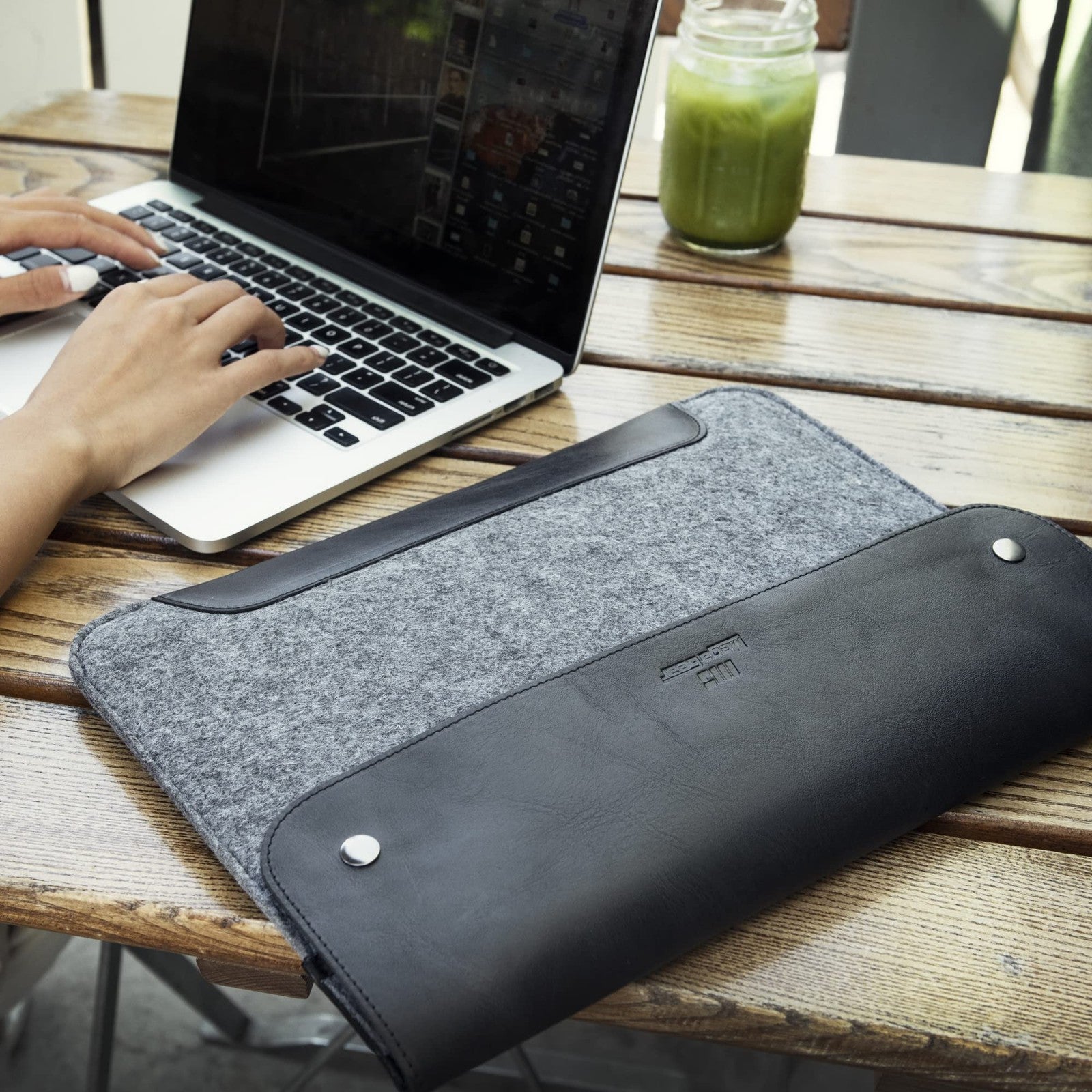 MegaGear genuine leather and fleece MacBook bag with padded interior for MacBook Pro, stylish and protective laptop sleeve.