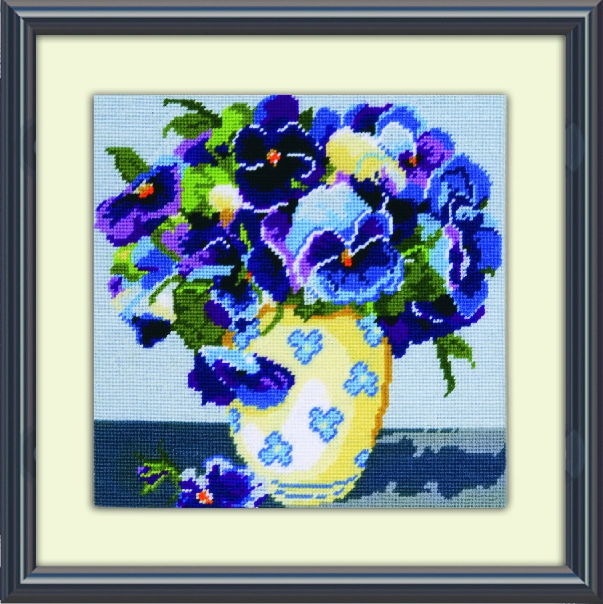 Design Works Crafts needlepoint kit featuring colorful pansies on a 10x10 inch canvas for embroidery or needlework.