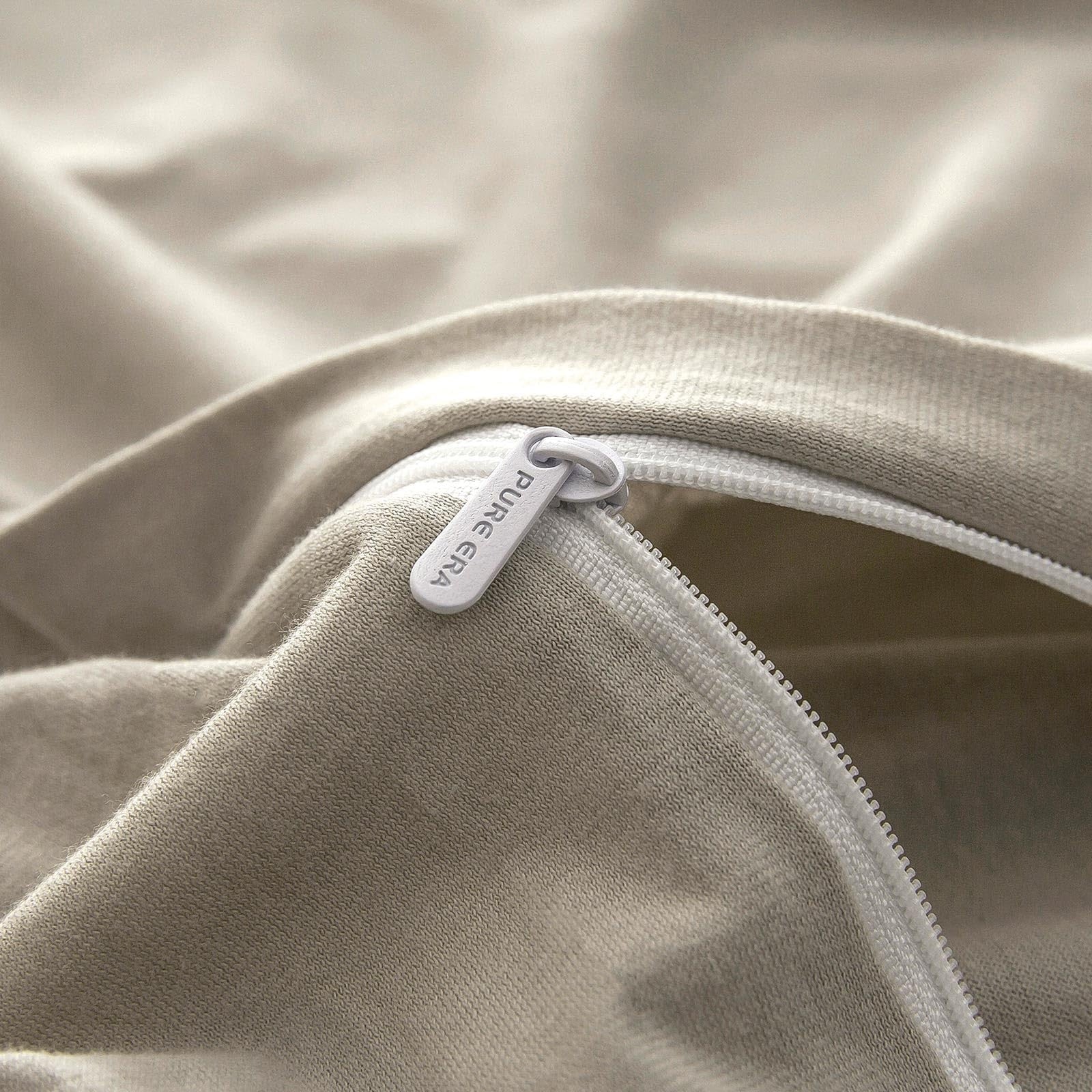 Pure Era jersey knit duvet cover set featuring soft, breathable 100% cotton fabric and matching pillowcases in a cozy 3-piece design.
