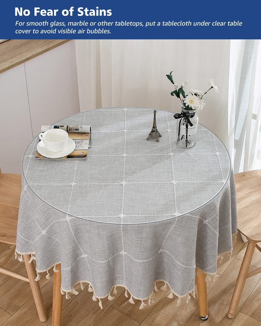 Soroel 24-inch round clear waterproof dining table cover with easy-to-clean surface protecting a wooden table.