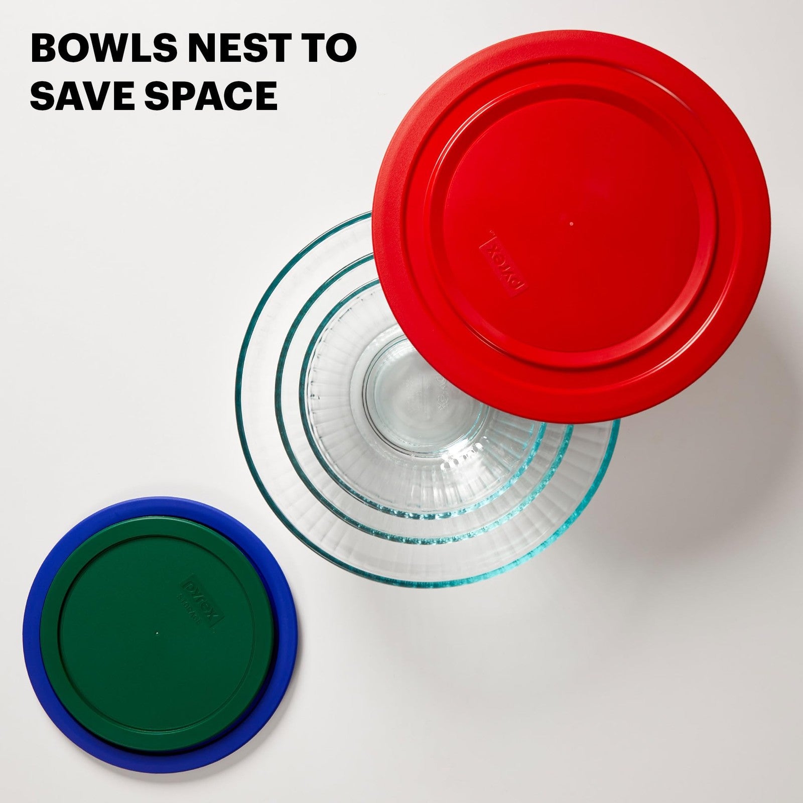 Pyrex sculpted 3-piece glass mixing bowl set with lids for prep, mixing, and storing food in a kitchen.
