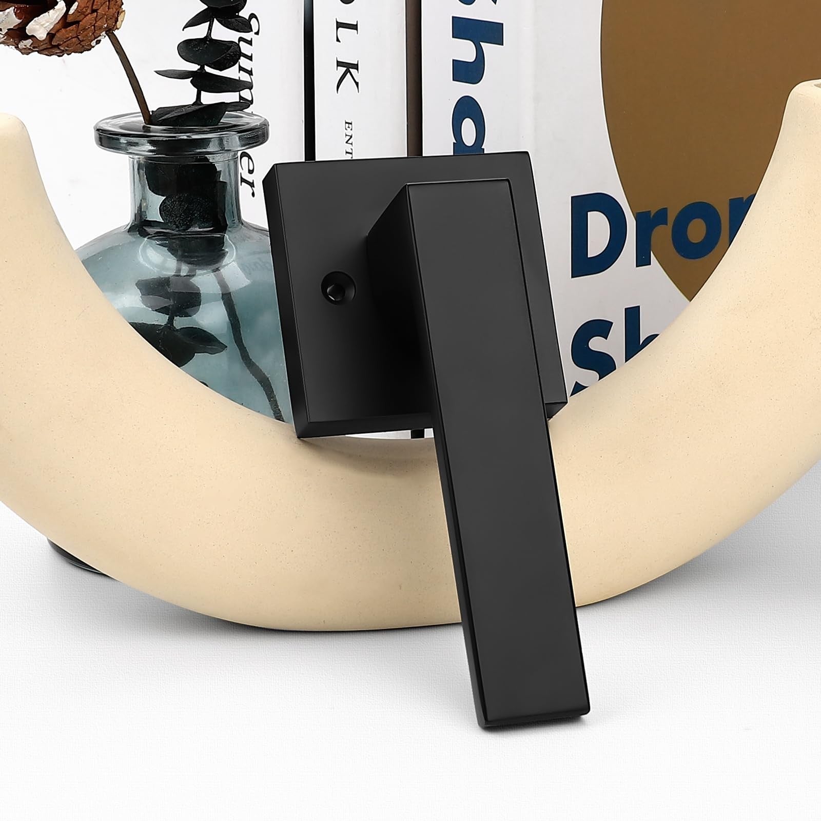 Probrico matte black stainless steel non-turning half-dummy door lever with square design, mounted on a door.