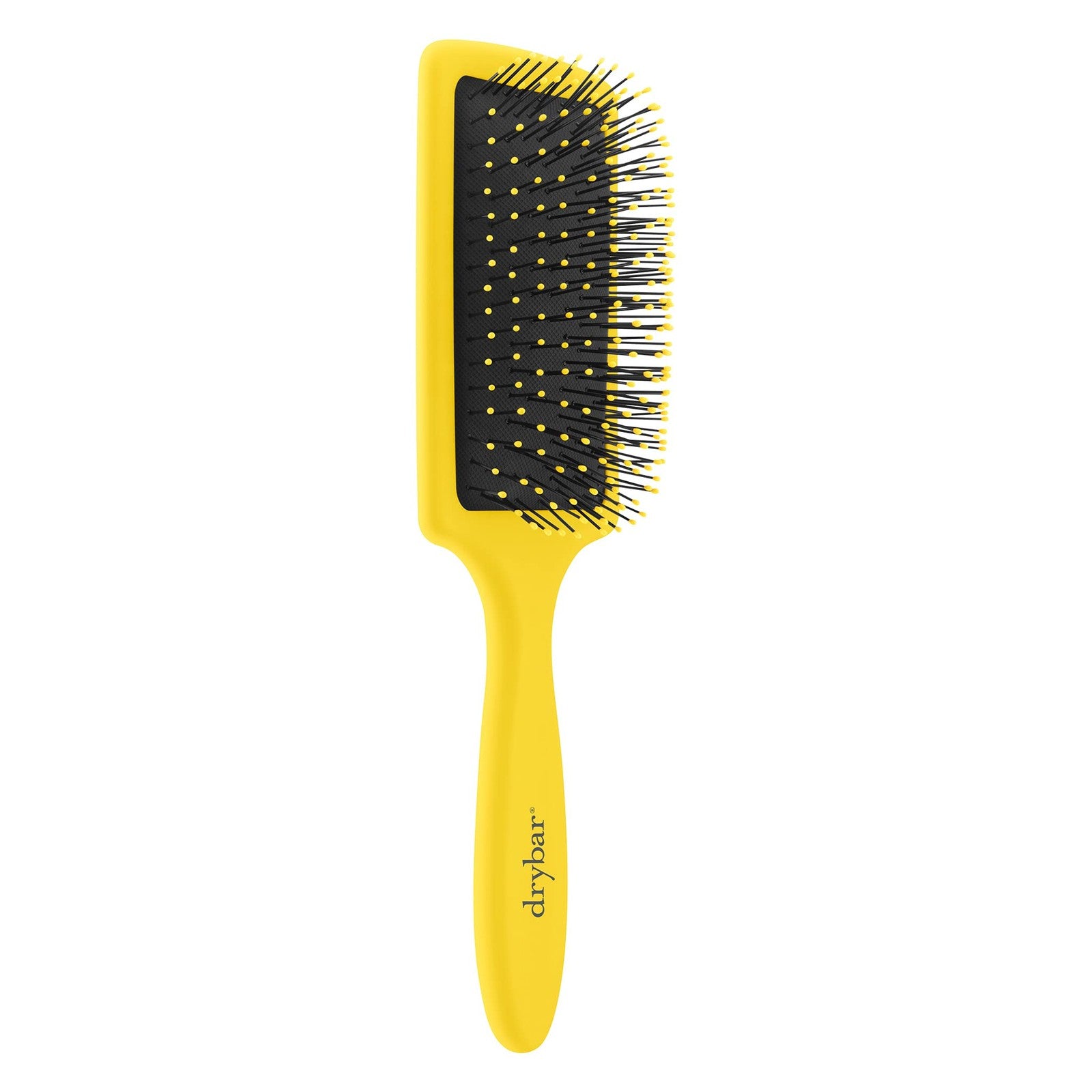 Drybar The Lemon Bar Paddle Brush with yellow handle and wide-bristle surface for smooth hair styling.