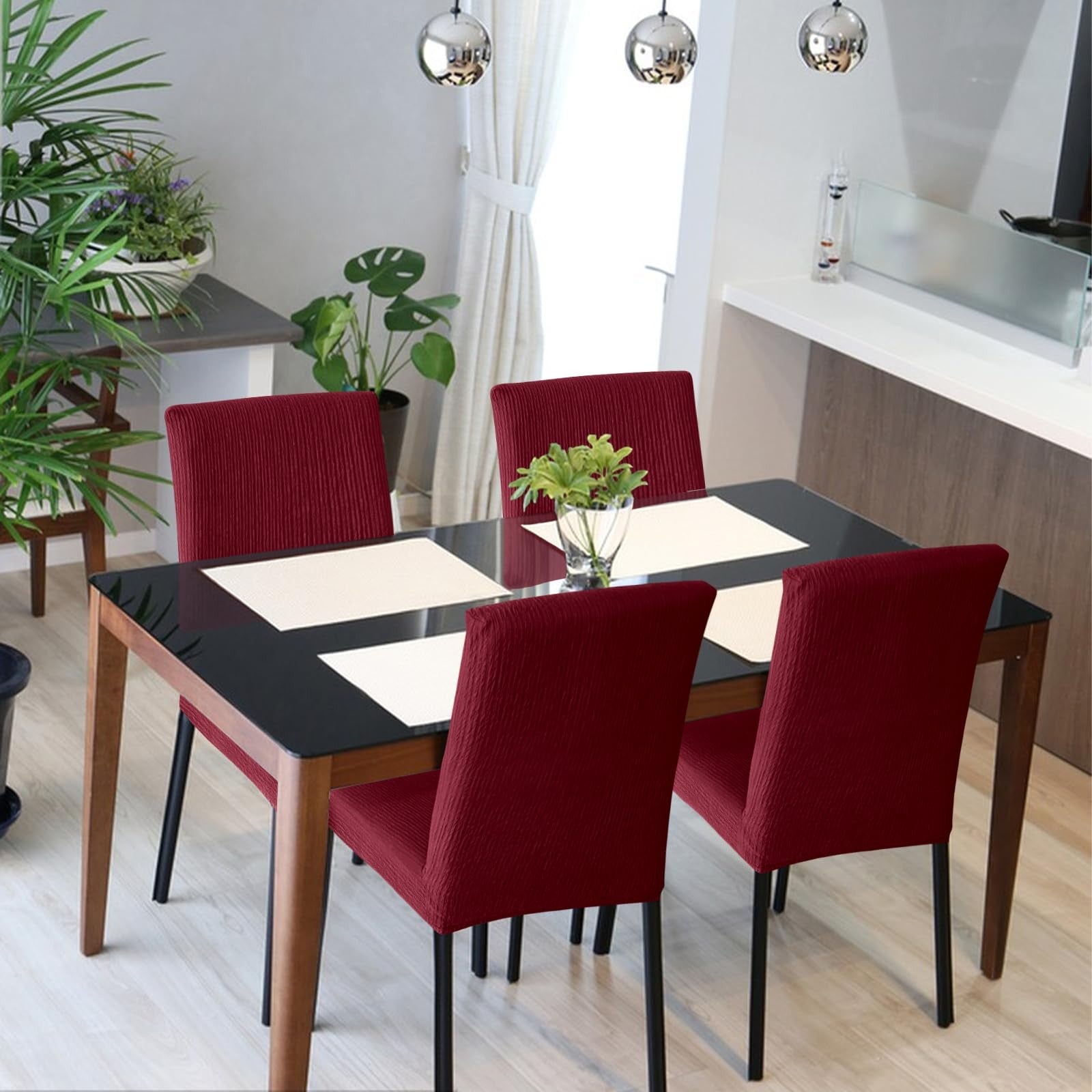 Set of four Fafua stretch dining chair covers in neutral fabric, featuring removable and washable slipcovers for a fitted look.