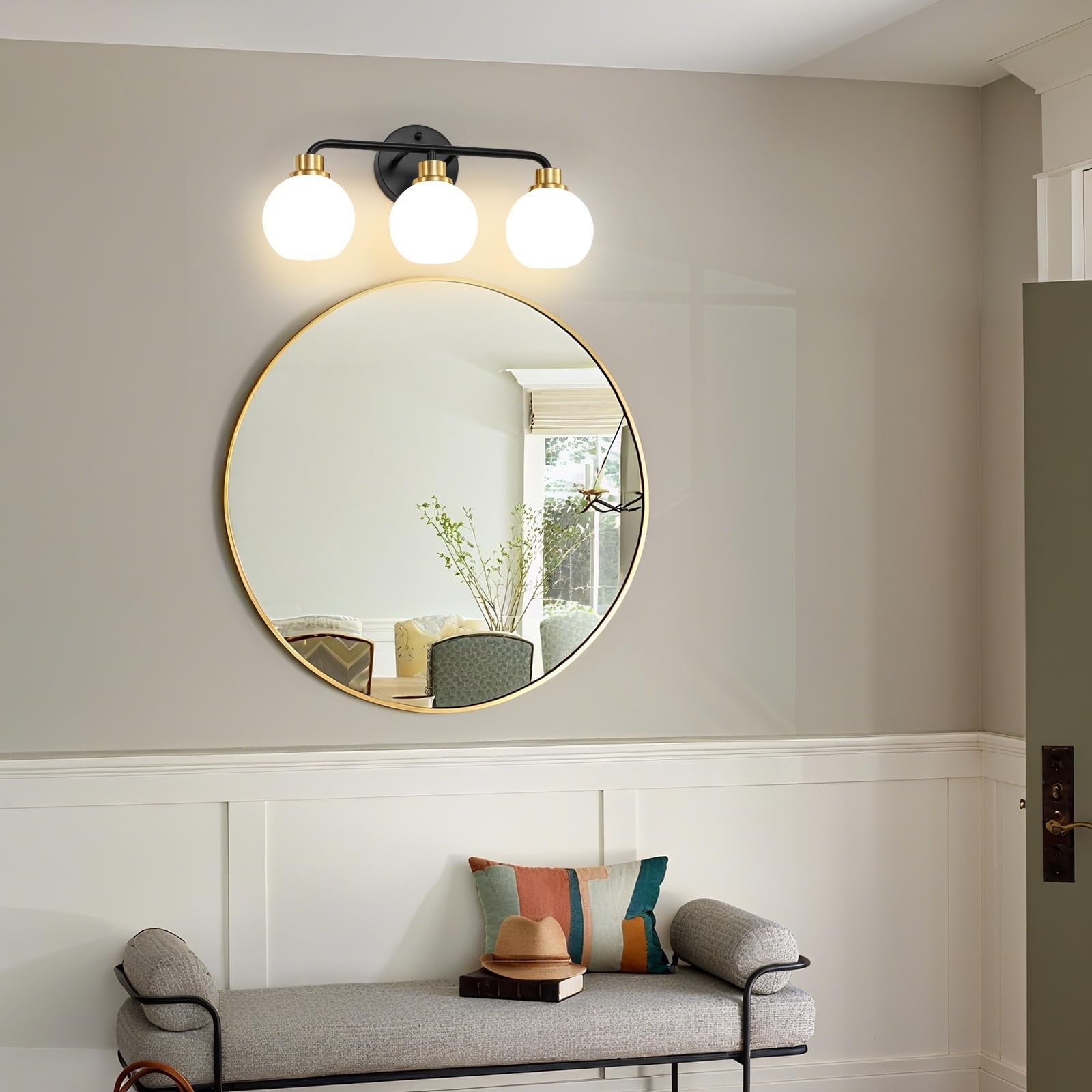 Watyo 3-light bathroom vanity light fixture with black and gold finish and milk glass shades, ideal for modern bathroom decor.