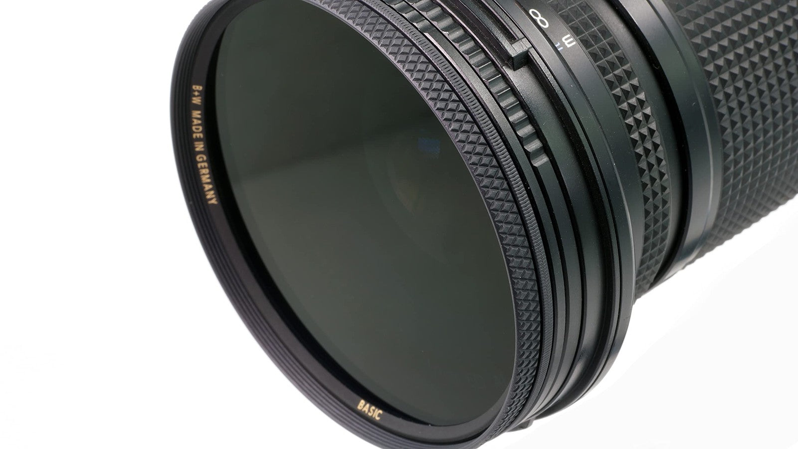 B+W 46mm circular polarizer glass filter for autofocus lenses, reducing reflections and enhancing image clarity.