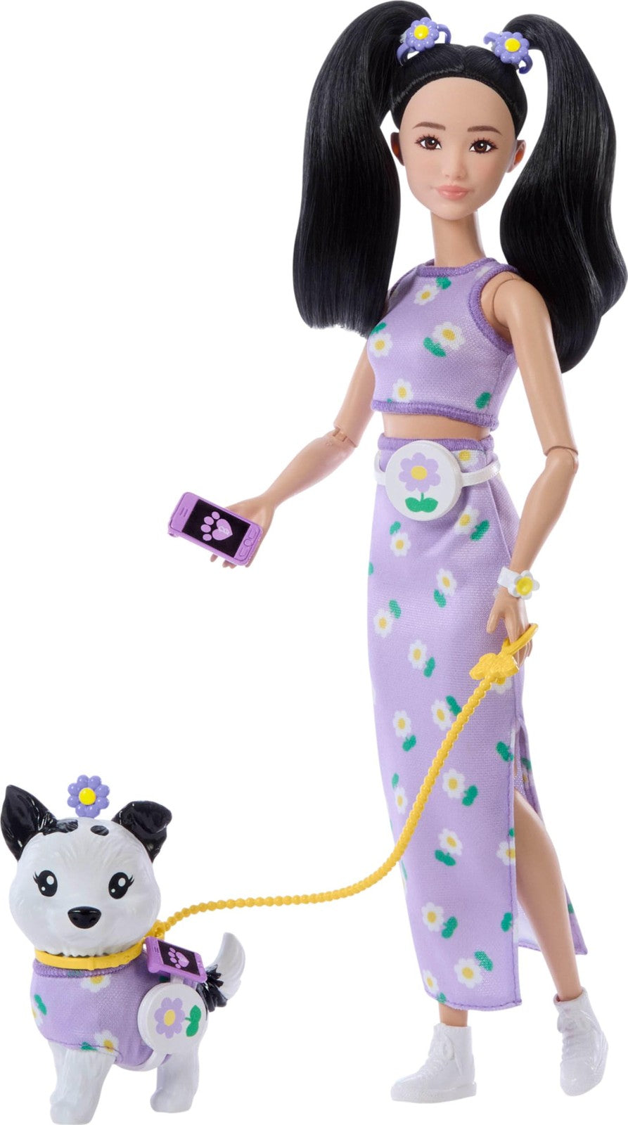 Barbie Twinning Looks doll and pet dog wearing matching purple daisy outfits, showcasing coordinated fashion accessories.