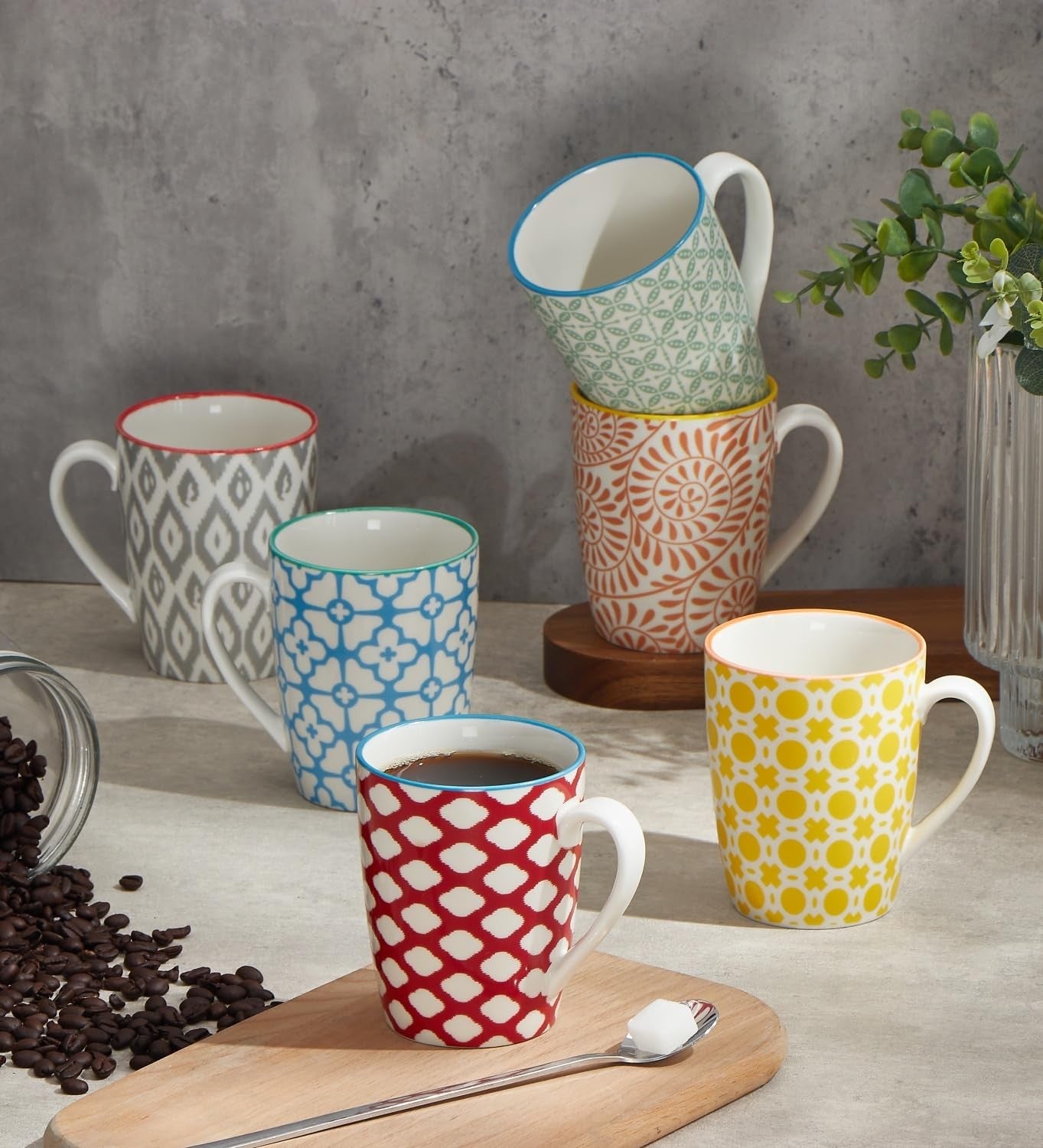 Set of six ONEMORE 12 oz ceramic coffee mugs with handles, white porcelain cups, showing their round shape and smooth finish.