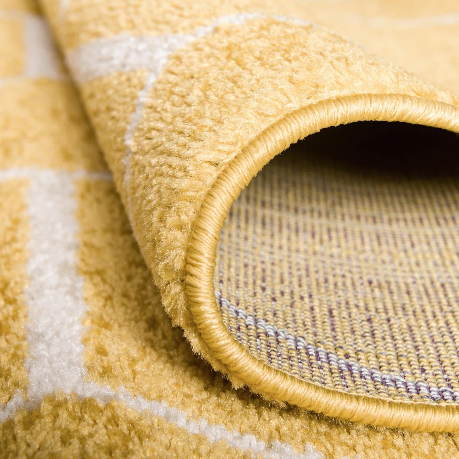 Unique Loom Trellis Frieze geometric round yellow area rug with modern design and textured surface.