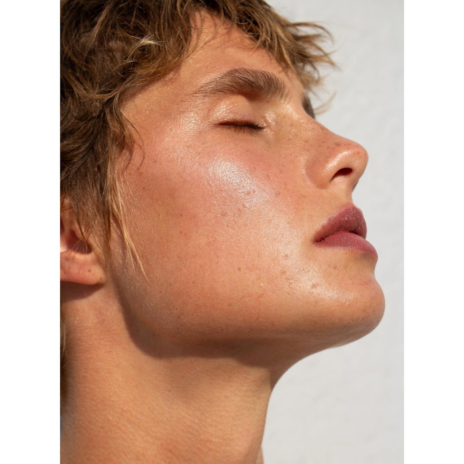 NOTO Botanics Organic Hydra Highlighter Stick on skin, showing natural glow and smooth texture, perfect for face and body highlighting.