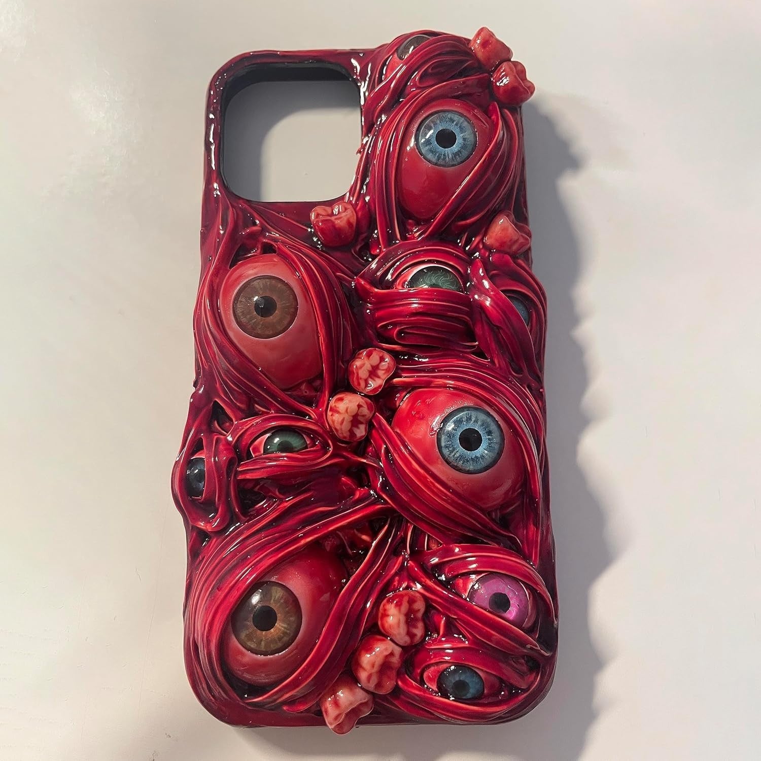 TRADAY scary horror phone case with creepy 3D eyes for iPhone 16 Pro, featuring a dark, eerie design with realistic eye details.