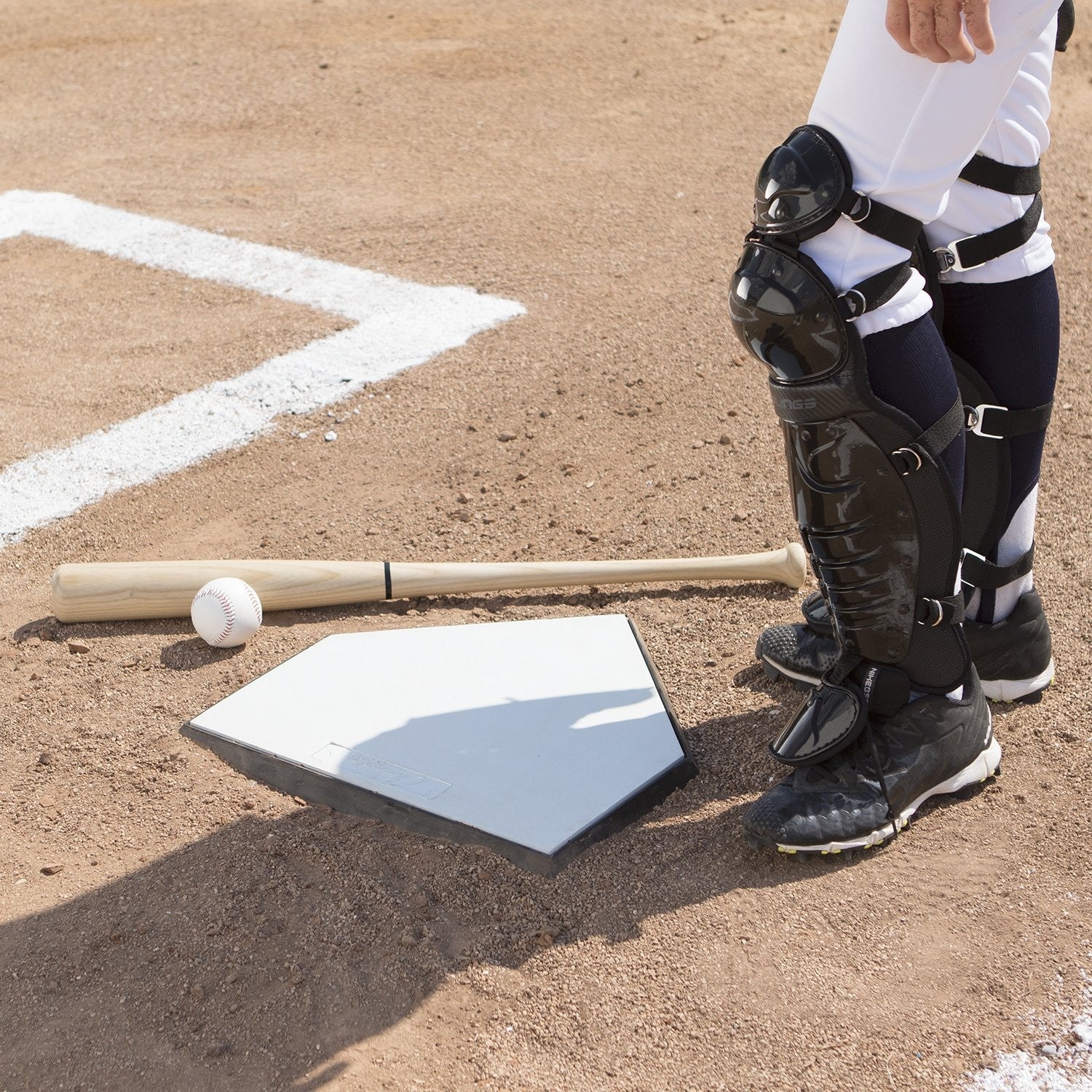 Champion Sports Pro Bury All homeplate with waffle bottom for durable baseball or softball field installation, shown on a field.