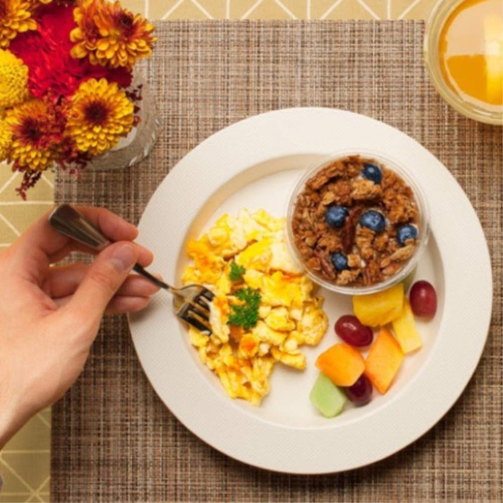White polycarbonate Ergo Plate by SP Ableware, 9-3/4-inch diameter, showing smooth round surface with built-in handles for easy grip.