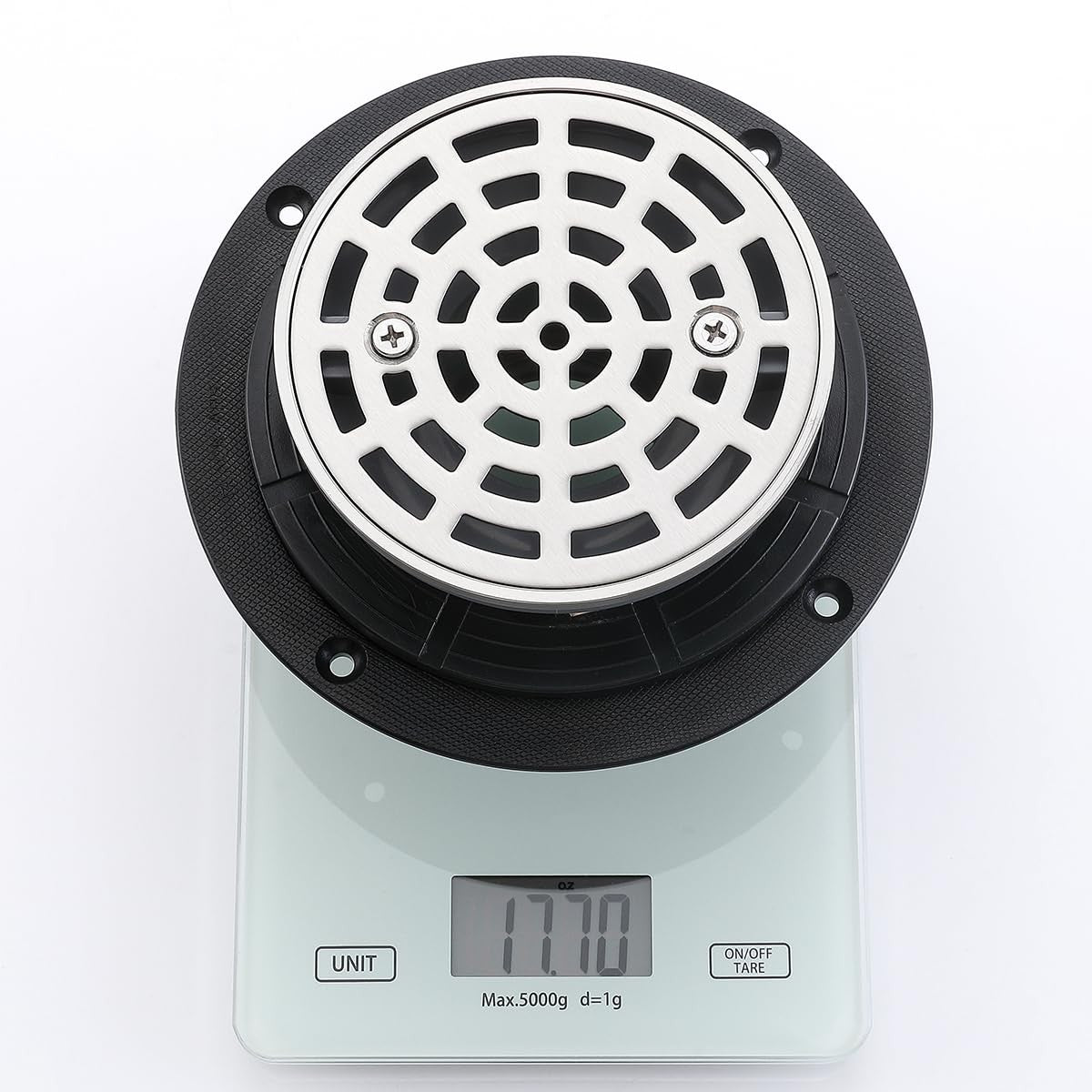 Random round brushed nickel shower drain with adjustable PVC, 4 inches, featuring a sleek, modern design for bathroom flooring.