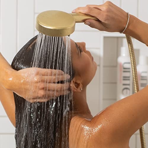 UNITE BOOSTA Conditioner for fine hair, volumizing and hydrating hair with a sleek bottle and rich, creamy texture.