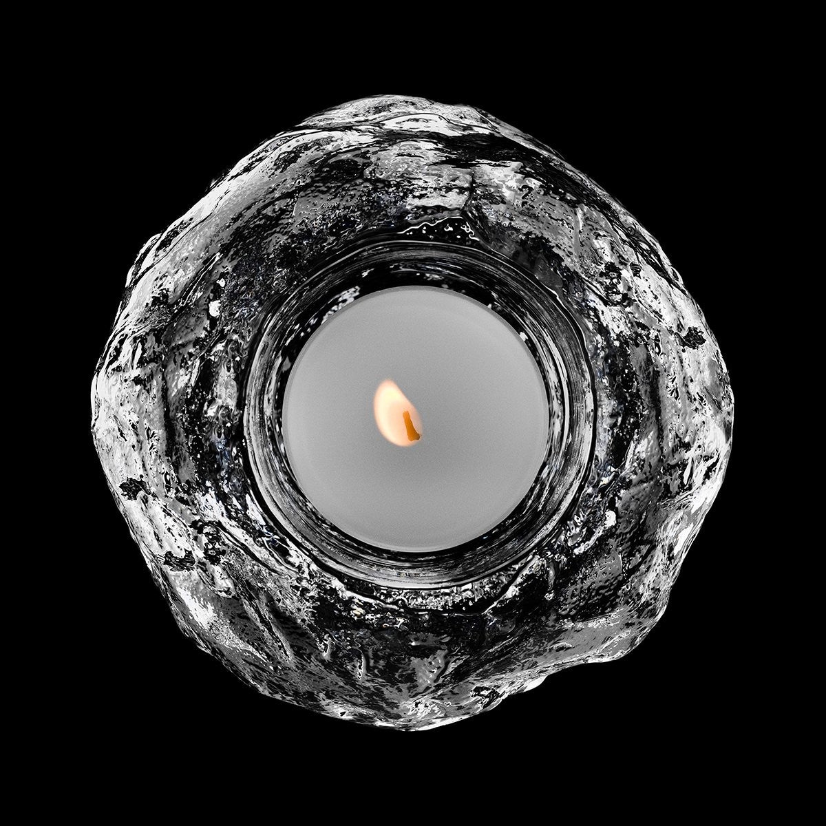 Orrefors Raspberry Votive with clear glass and raspberry color, featuring a sleek, modern design for decorative candle lighting.