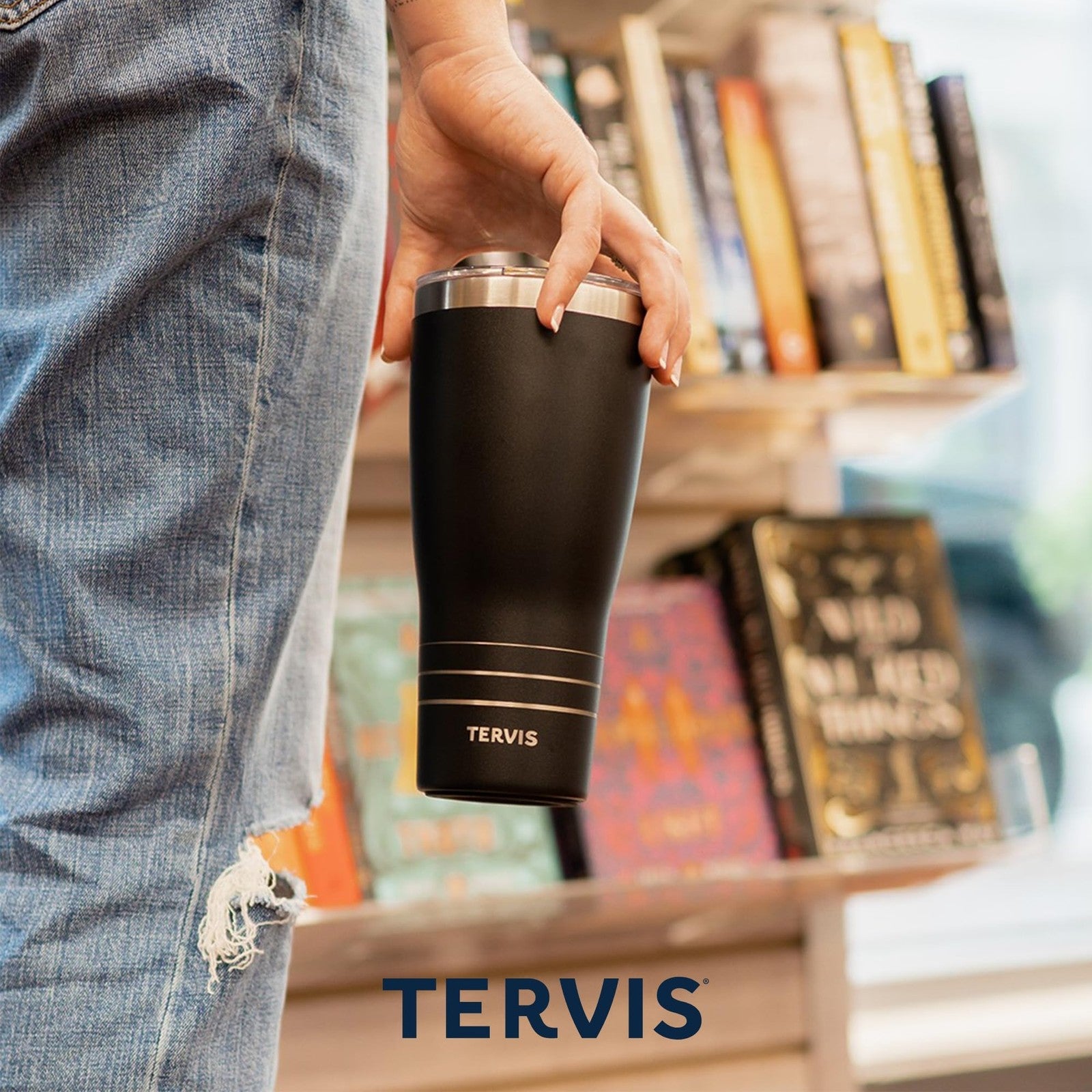 Tervis Wicked For Good gold triple insulated traveler tumbler with lid, designed for hot and cold beverages.