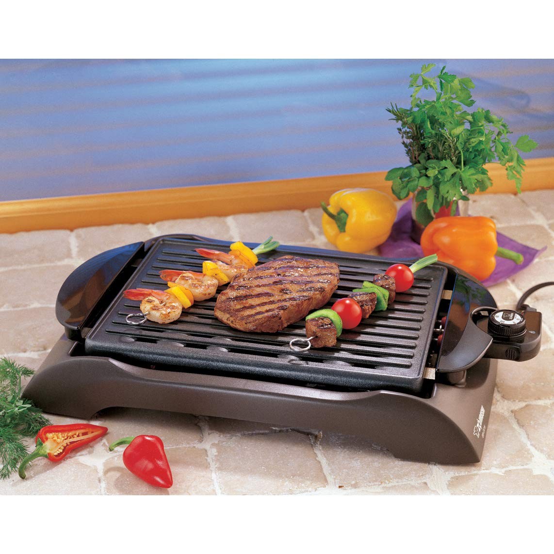 Zojirushi EB-CC15 indoor electric grill with non-stick cooking surface and adjustable temperature control.