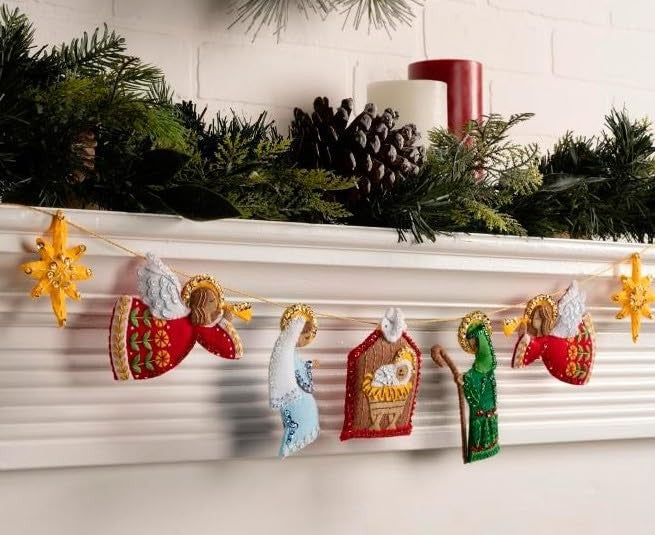 Bucilla felt applique Nativity garland kit featuring colorful felt figures for DIY arts and crafts projects.