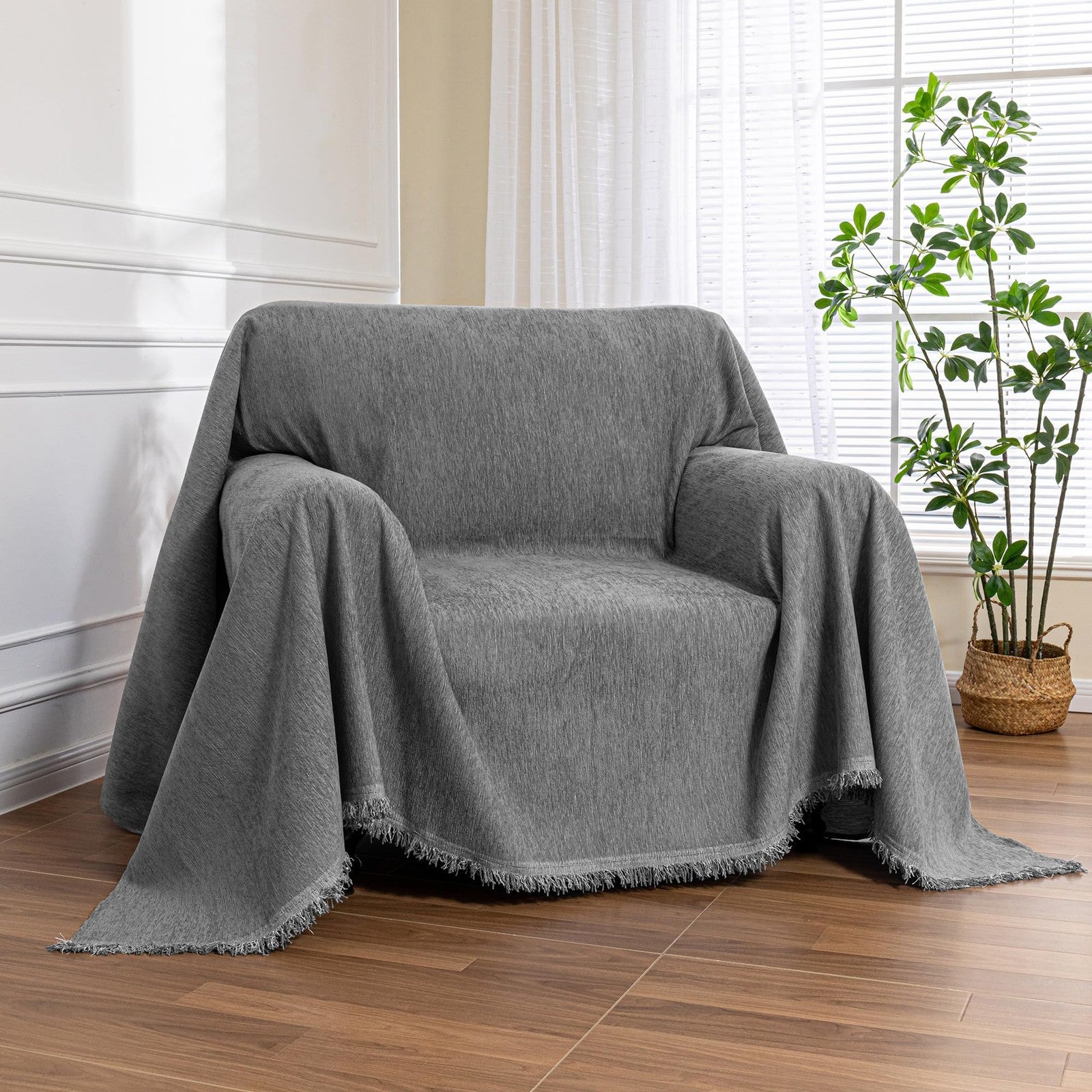 MEETSKY washable oversized chair cover on a recliner with armrests, protecting a modern armchair and couch in a cozy living room.