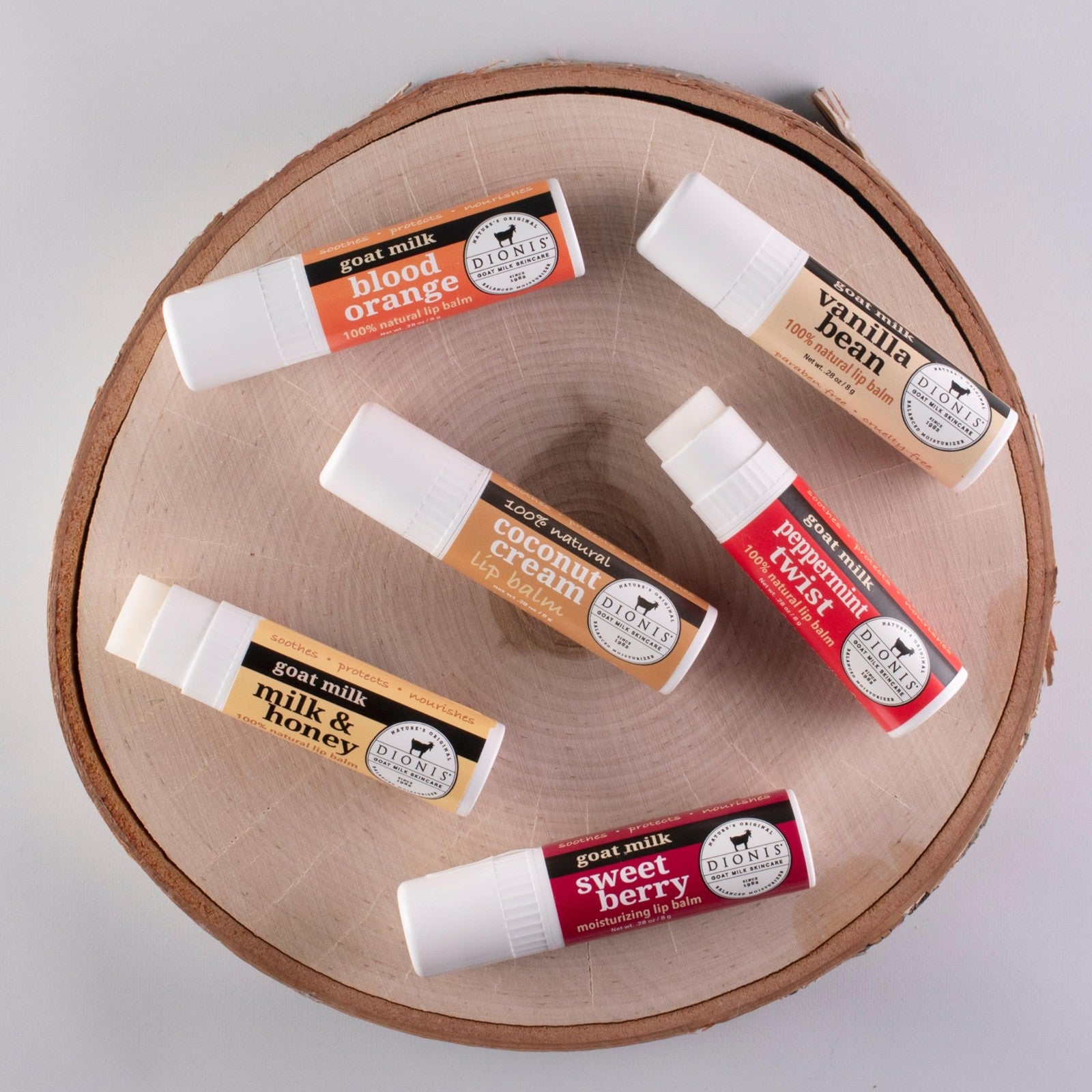 Set of six Dionis Goat Milk Lip Balm ornaments in 0.28 oz containers, featuring natural, nourishing lip care with goat milk.