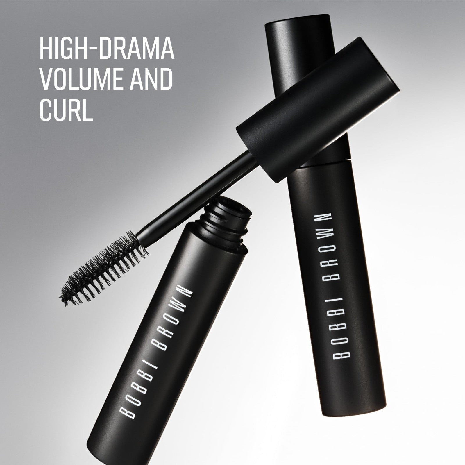 Bobbi Brown Eye Opening Mascara with a black brush, showing thickened, curled, and lifted eyelashes for high-volume eye enhancement.
