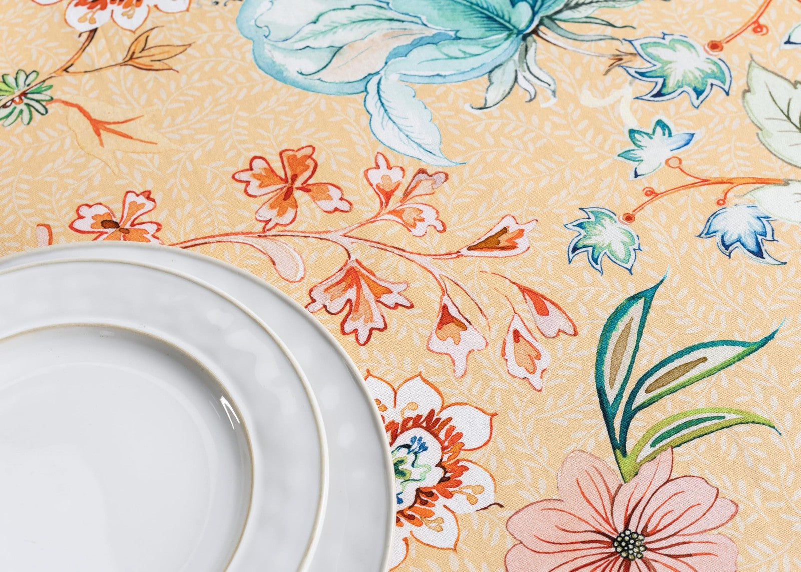 Round Maison d' Hermine cotton tablecloth, 63 inches diameter, featuring intricate patterns and a smooth, soft fabric surface.