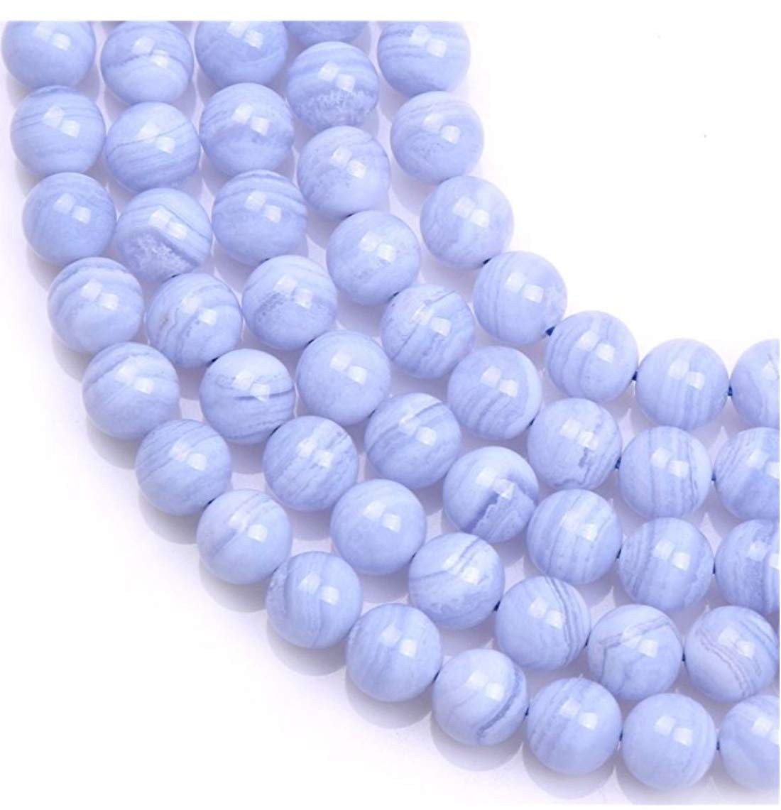 Two strands of small 4mm blue lace agate healing gemstones, round cut, natural blue color, arranged in a close-up view.