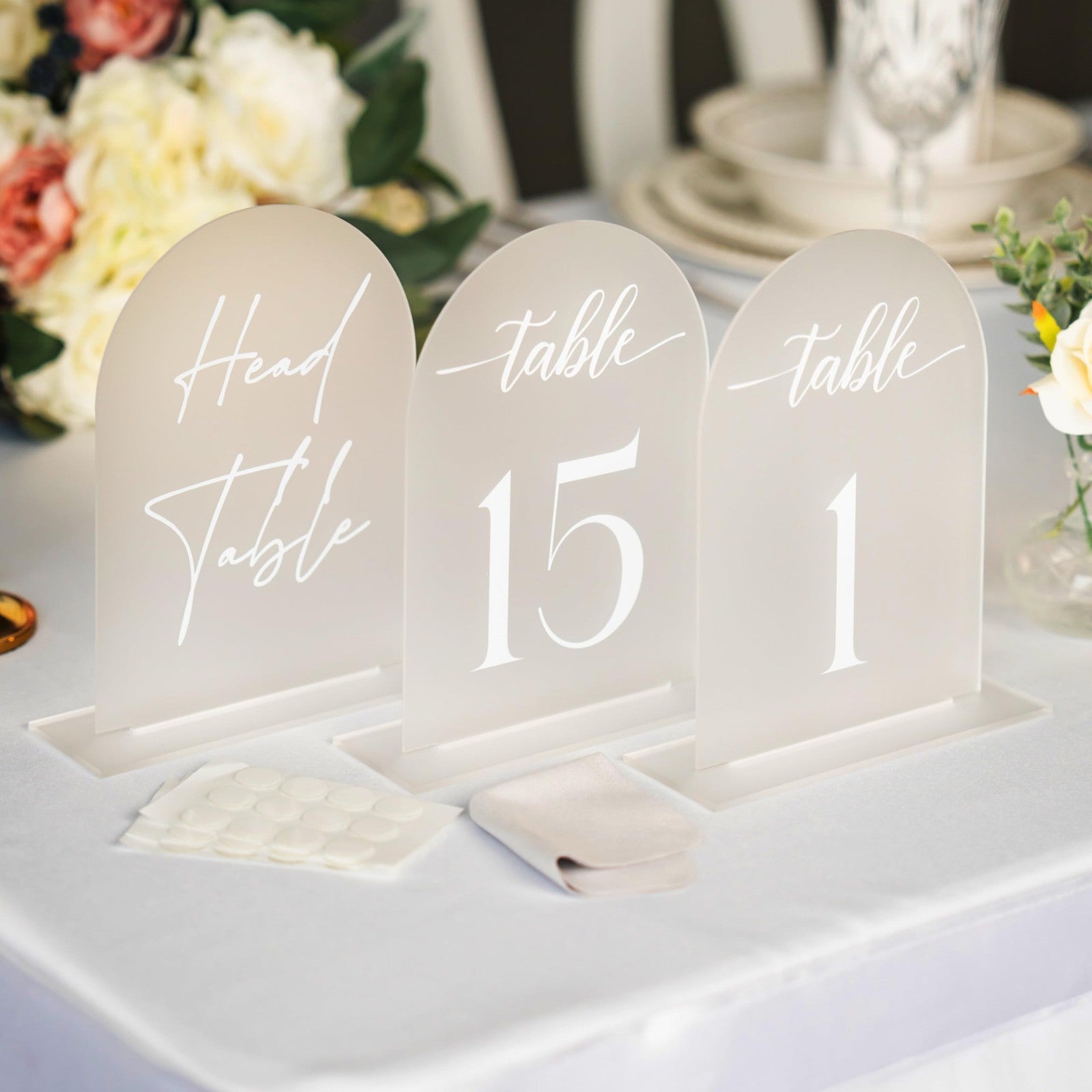 Frosted arch acrylic table number 5x7 inches with white font, ideal for wedding reception decor by SUBLIME SOIRÉE