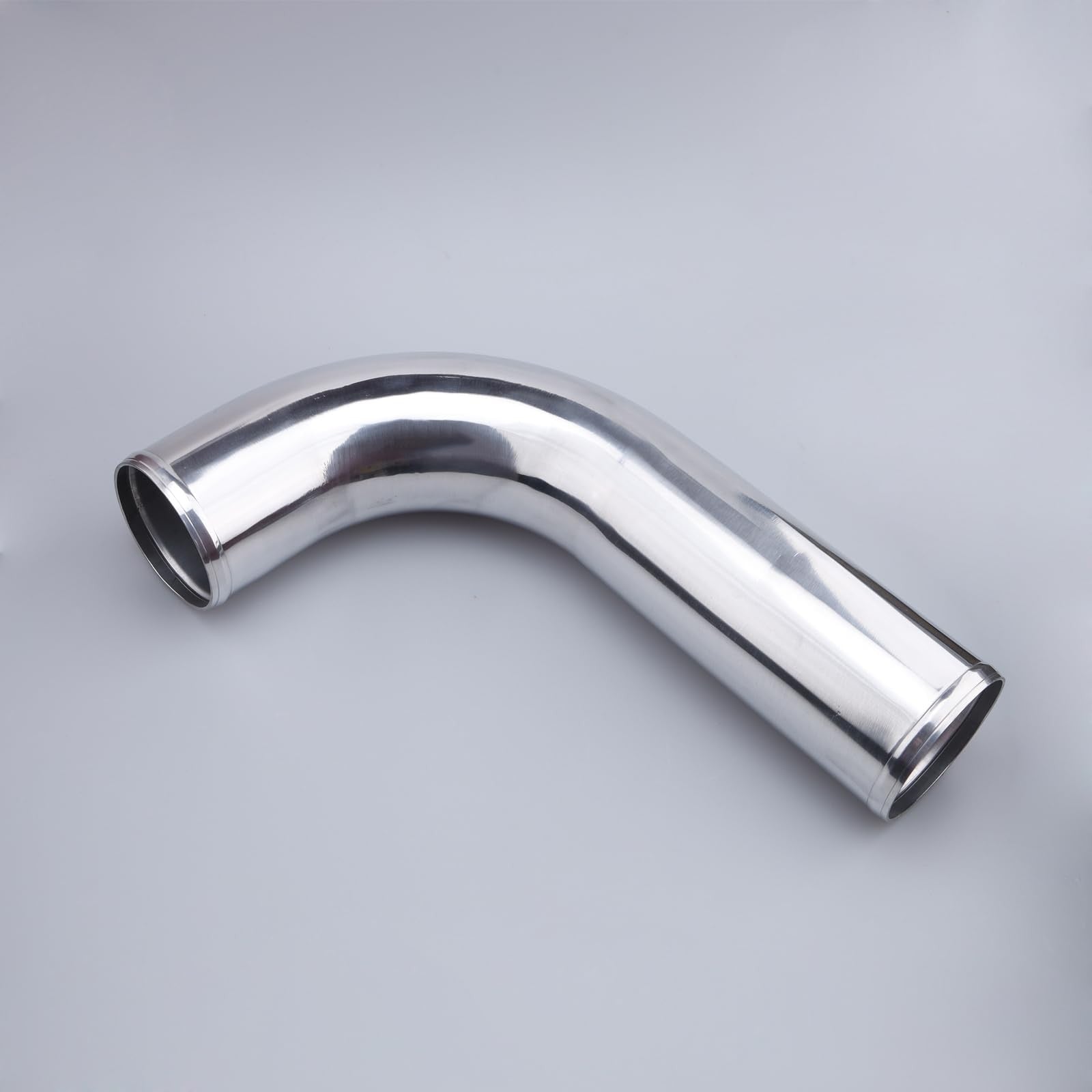 AC PERFORMANCE 3.5-inch OD aluminum intercooler pipe 90-degree L-bend tube with smooth metallic finish and precise bend for performance upgrades.