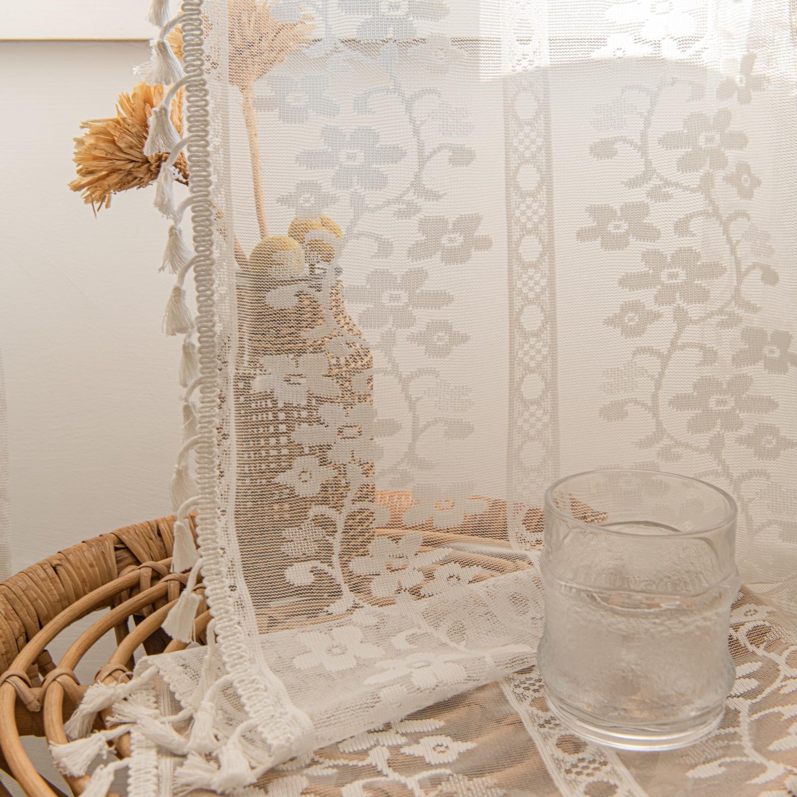Sutuo Home boho curtains with two 84-inch macrame floral crochet panels hanging in a window with natural light.